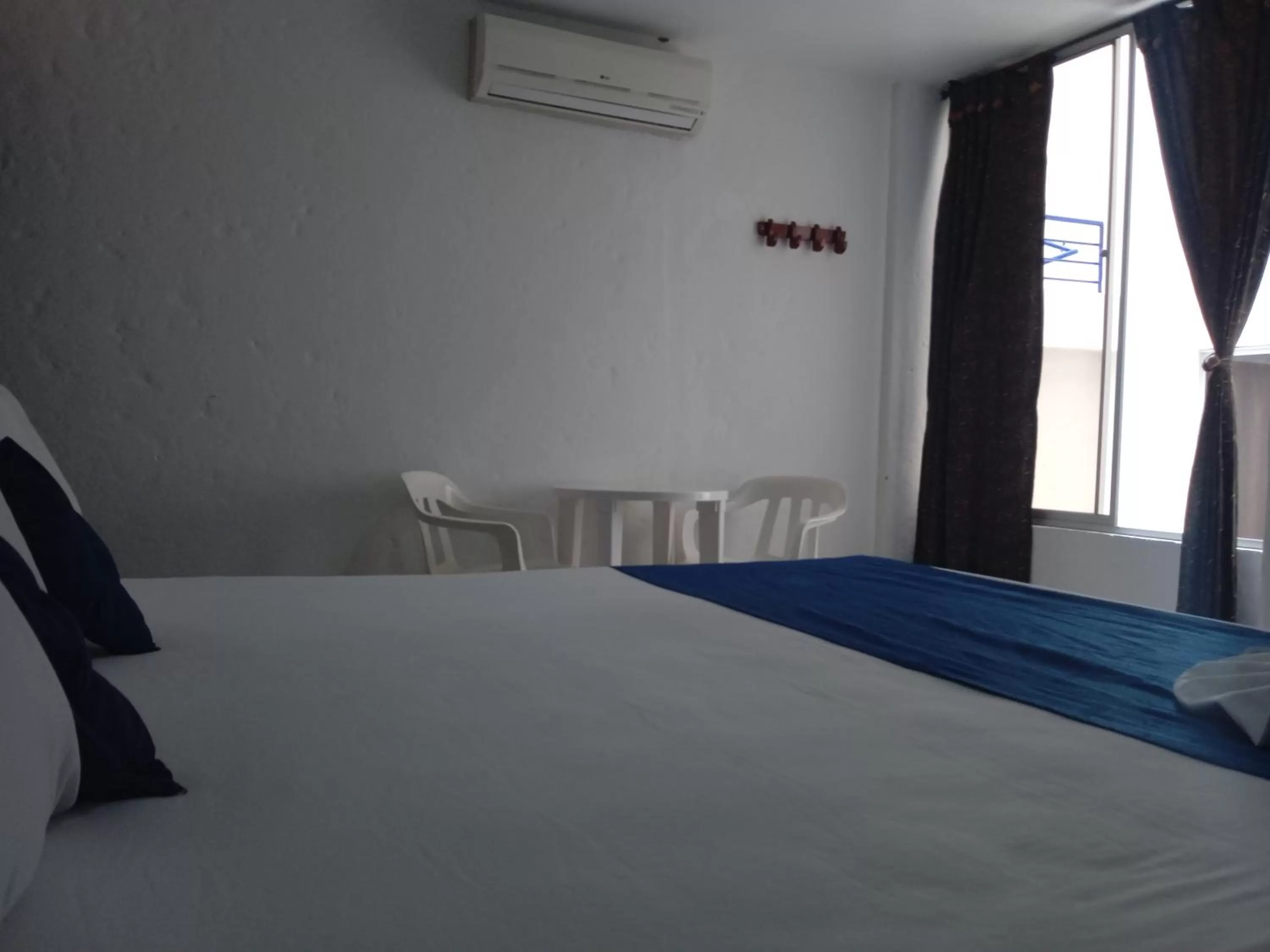 Bed in Blue Star Hotel