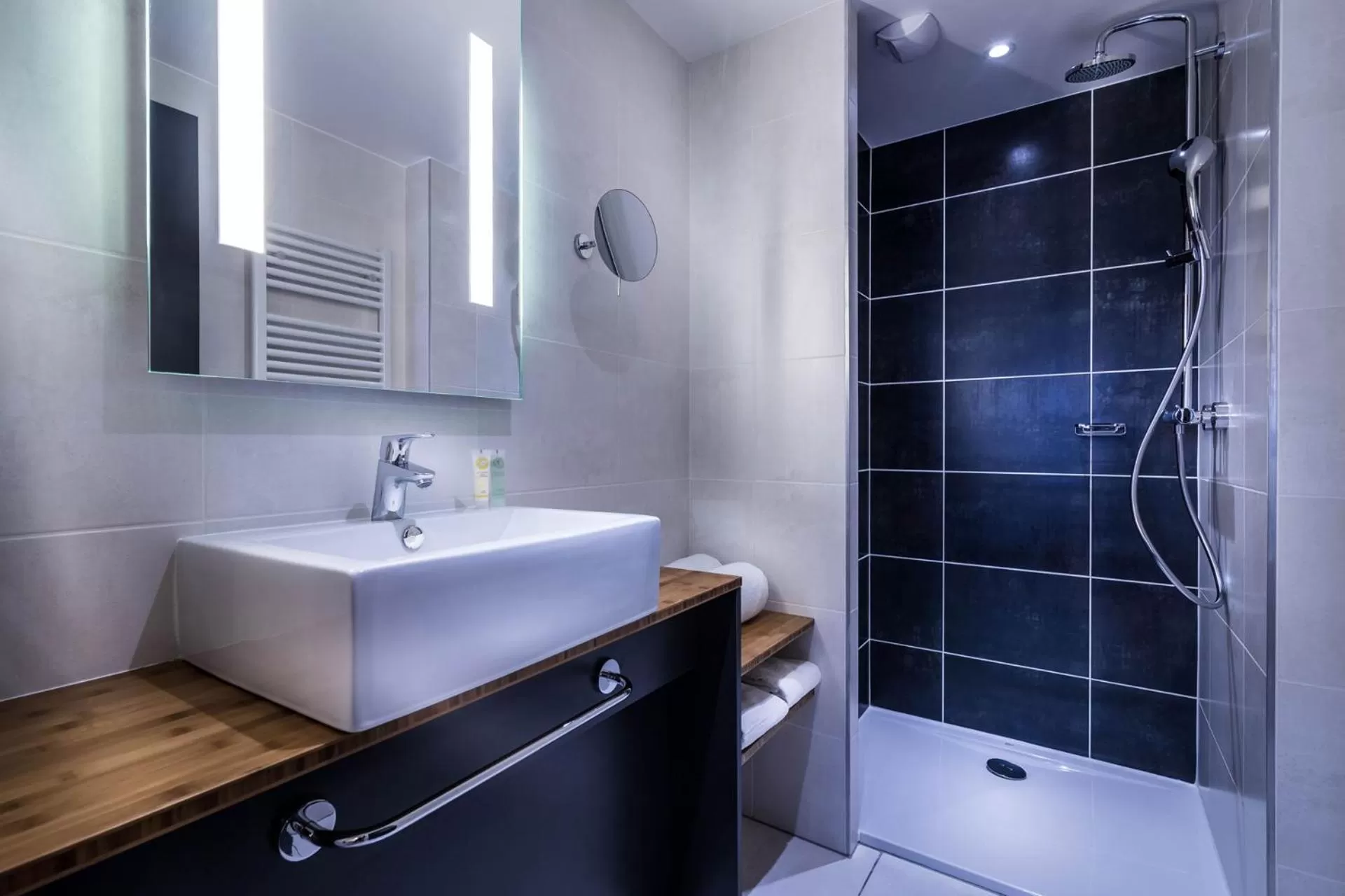 Shower in Best Western Plus Suitcase Paris La Défense