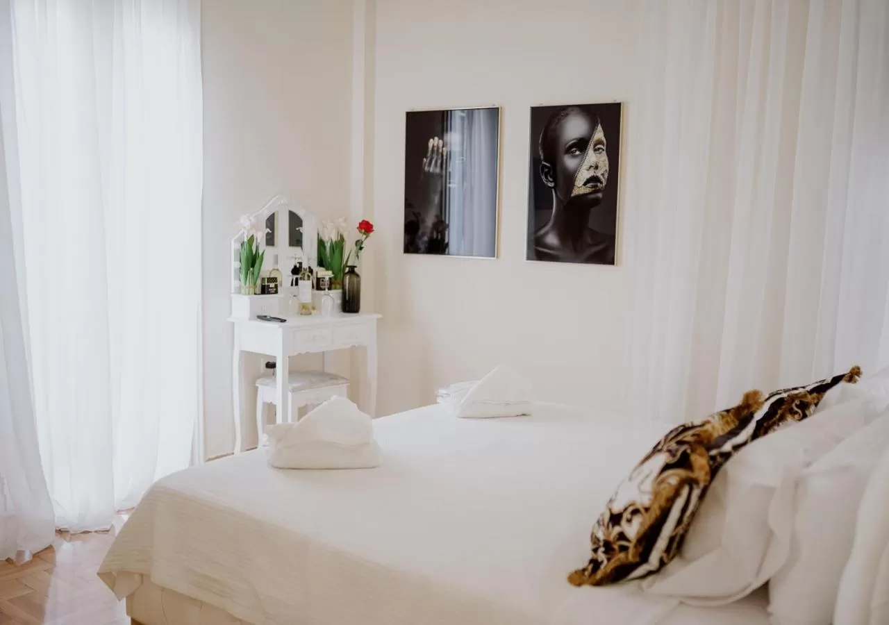 Photo of the whole room, Bed in ROH Suites