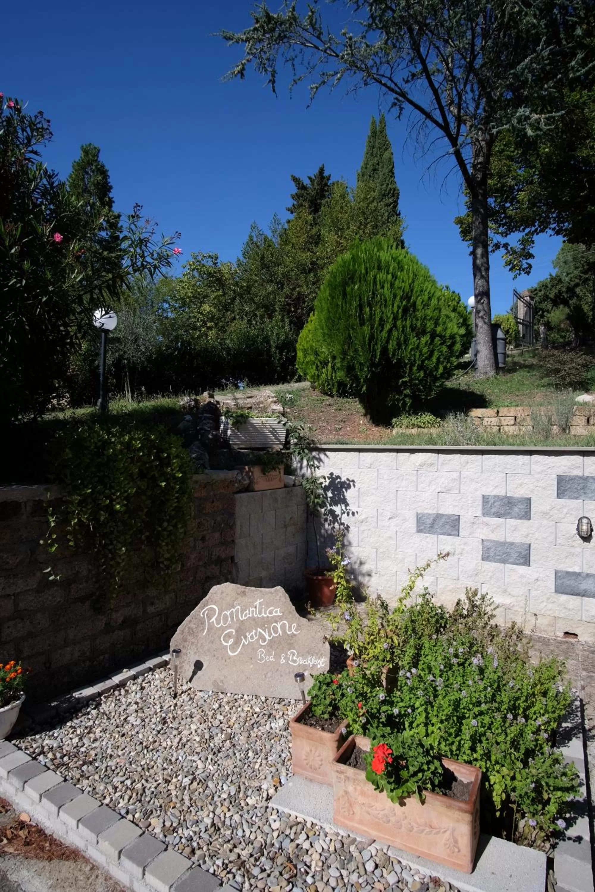 Property logo or sign in Bed and Breakfast Romantica Evasione