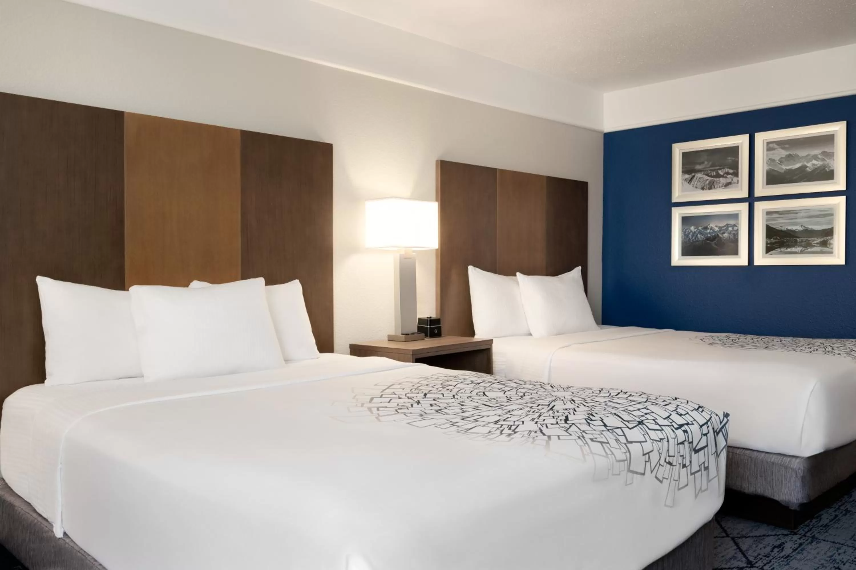 Bed in La Quinta Inn and Suites by Wyndham at WaTiki Waterpark