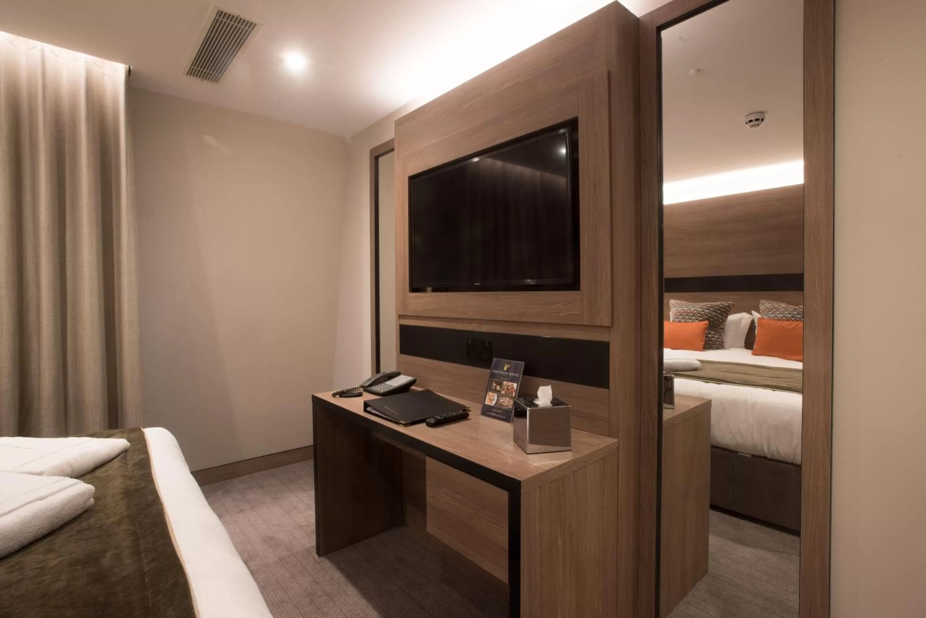 Bed in Merit Kensington Hotel