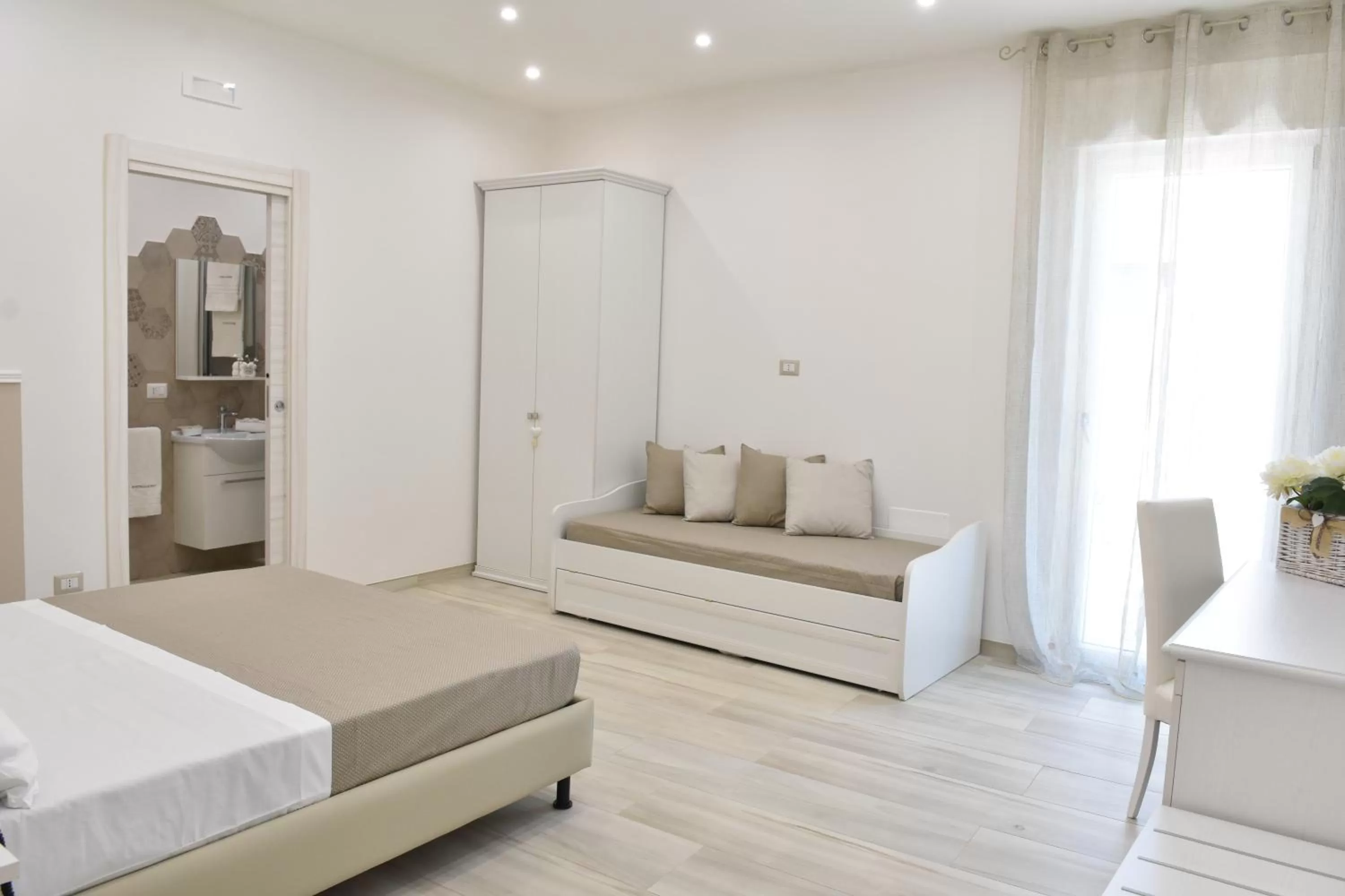 Garden view, Bed in Finestre sul Borgo