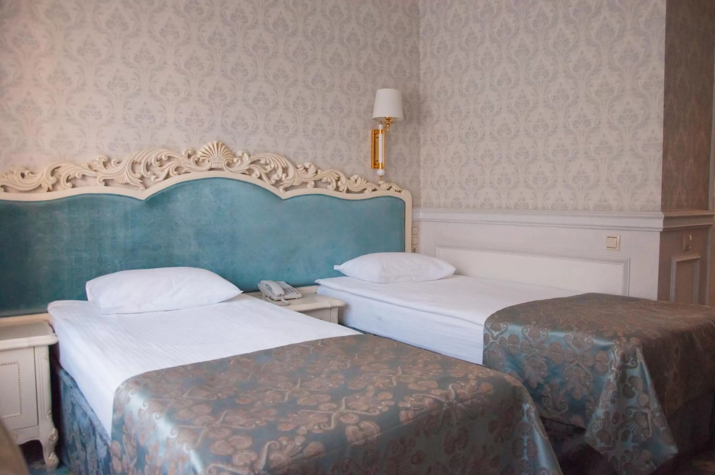 Bed in Royal Olympic Hotel