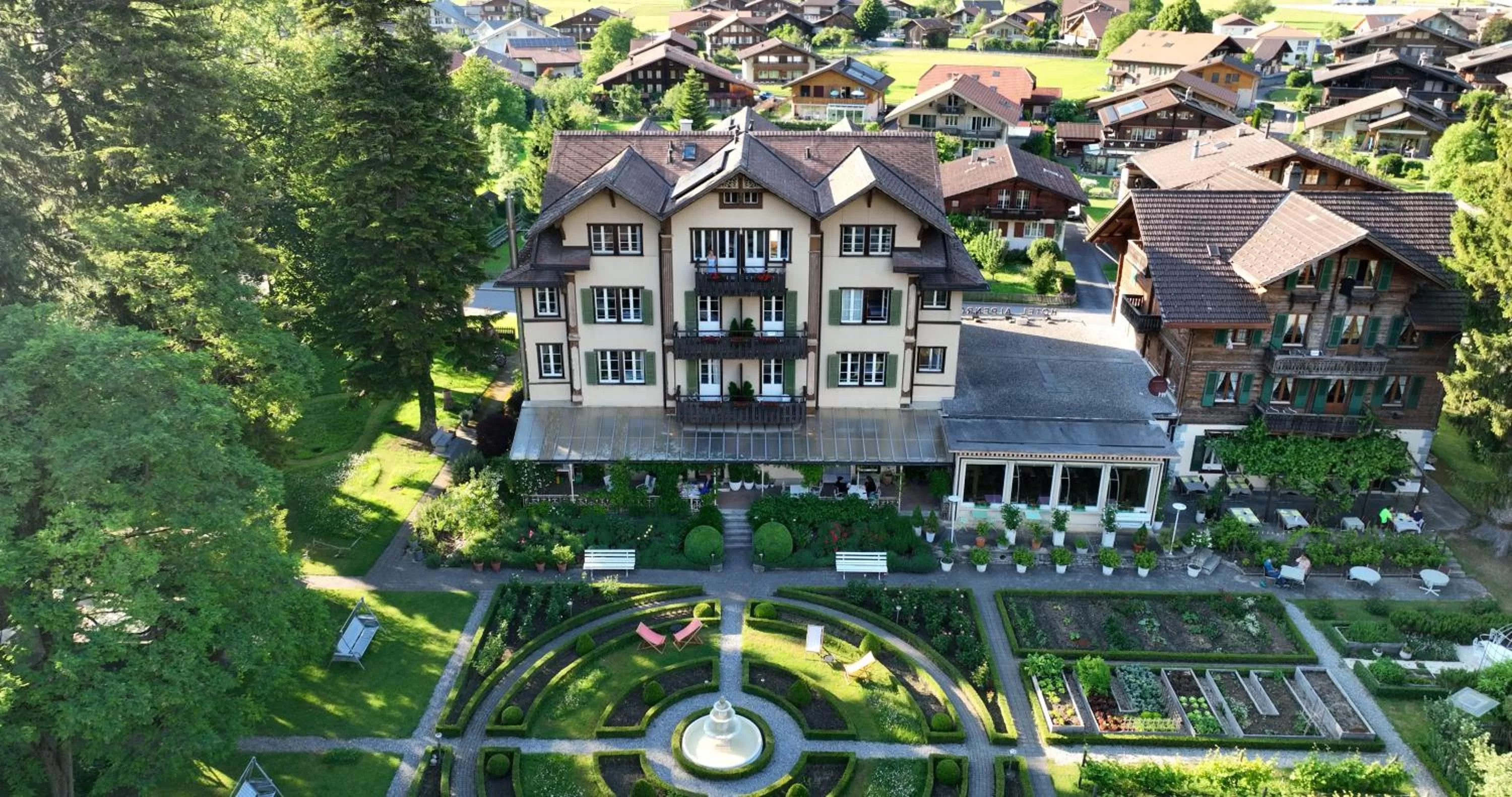 Property building in Alpenrose Hotel and Gardens