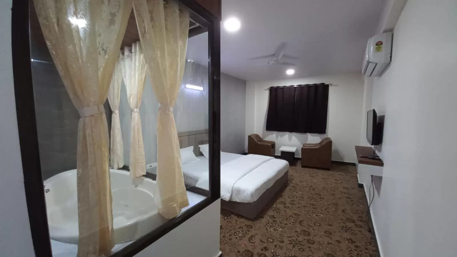 Photo of the whole room, Bed in Hotel Jurkis, Kolhapur