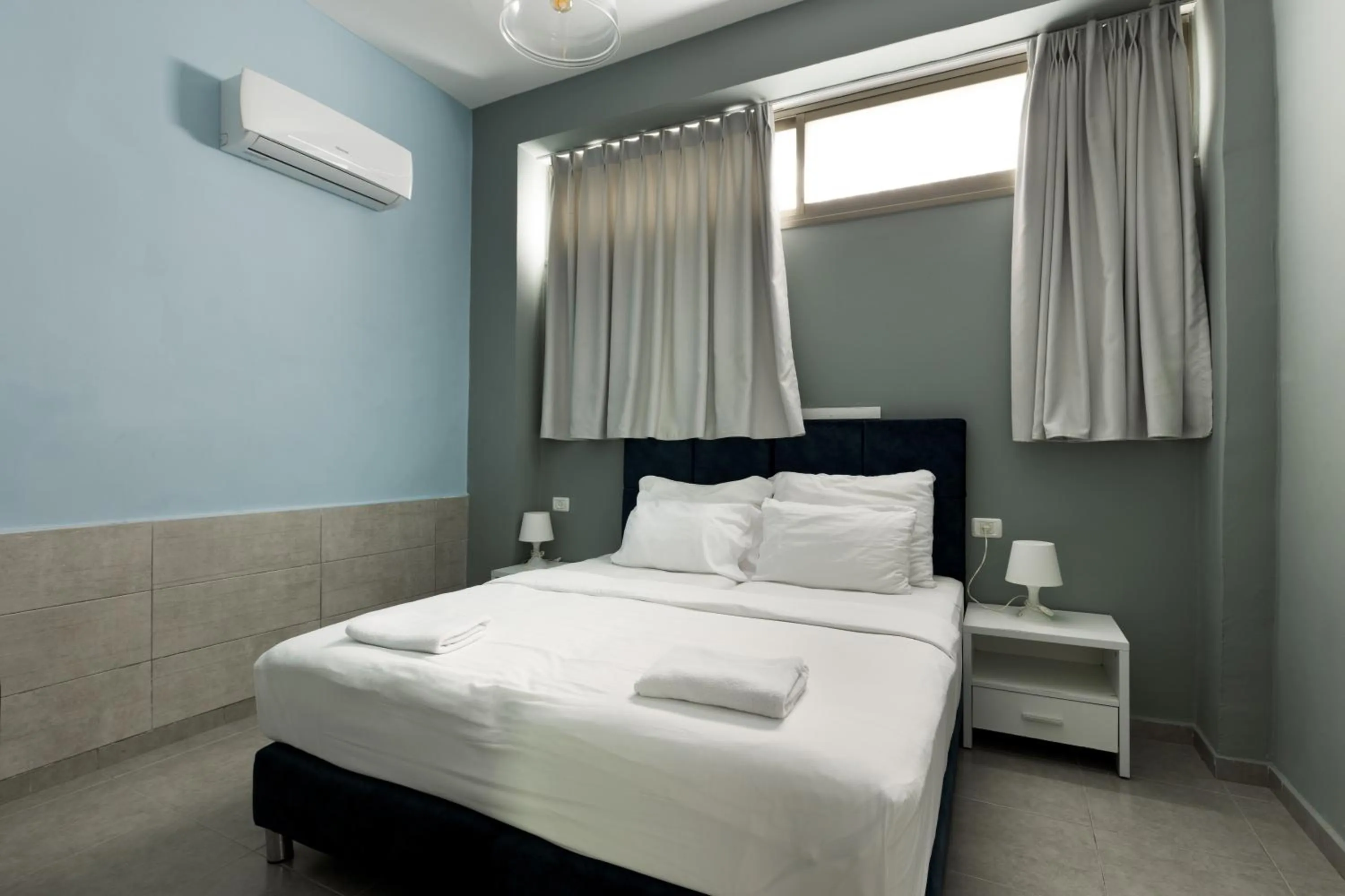 Bedroom, Bed in Liber Tel Aviv Sea Shore Suites BY RAPHAEL HOTELS
