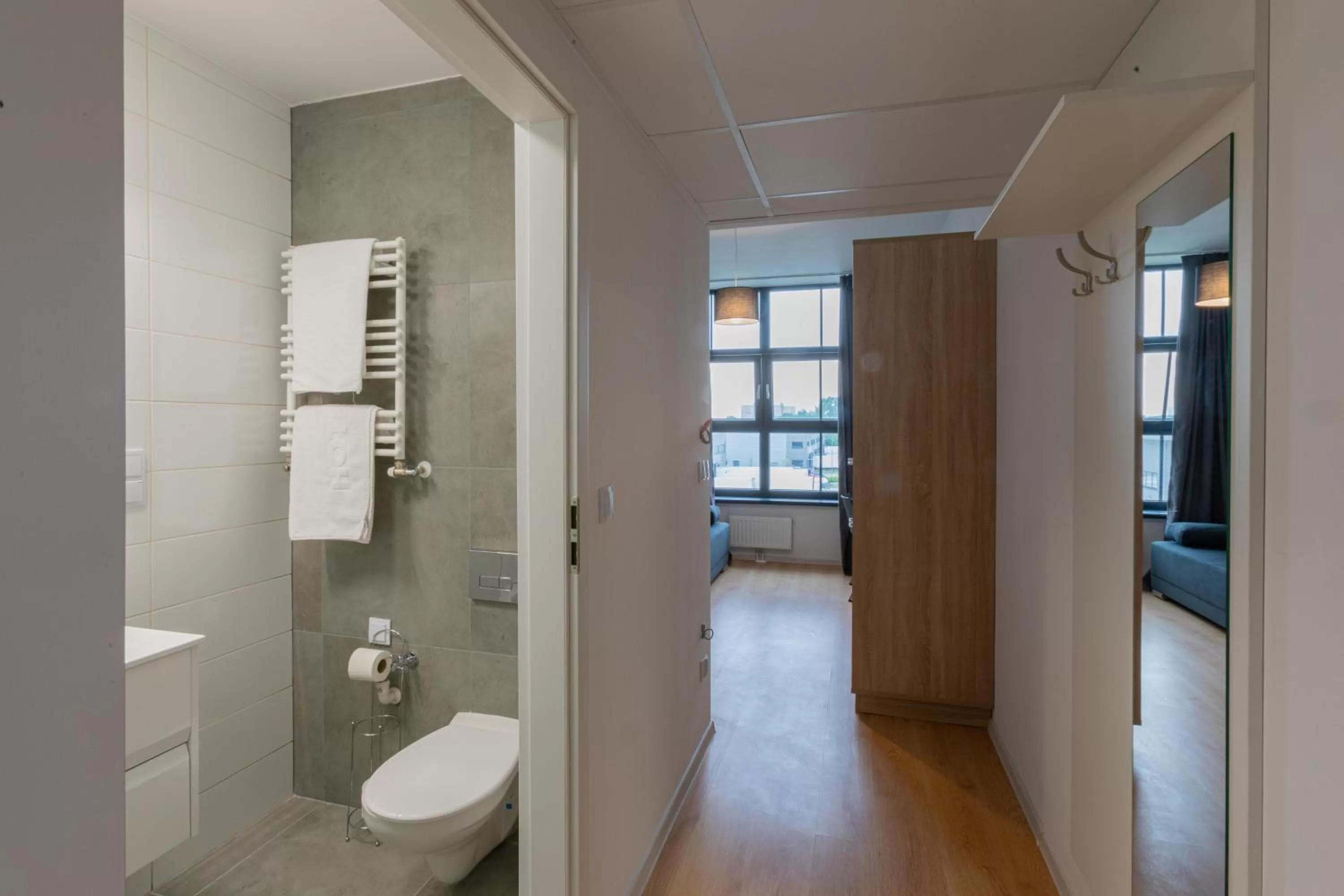 Toilet in SleepWell Apartments