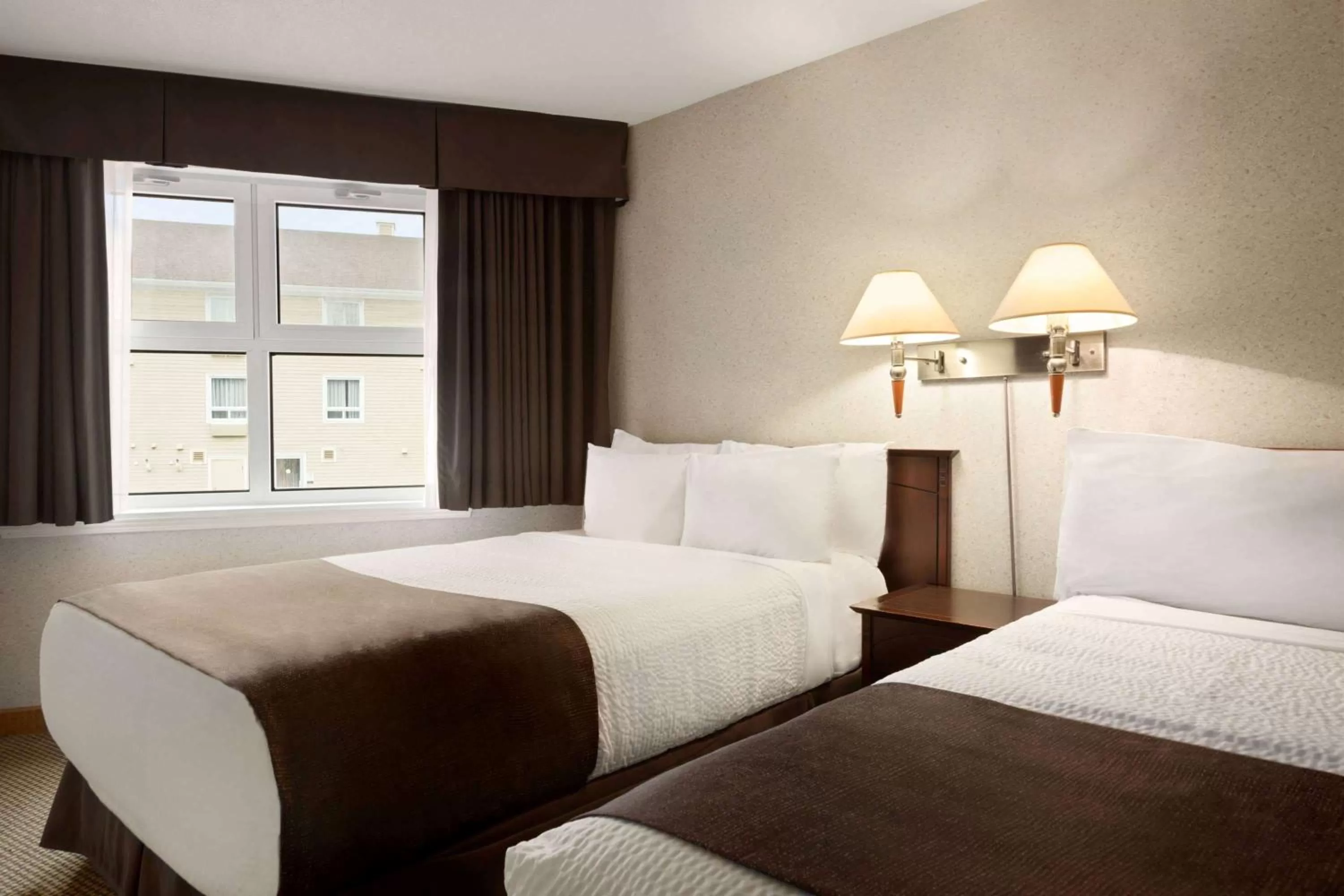 Photo of the whole room, Bed in Days Inn by Wyndham Trois-Rivieres
