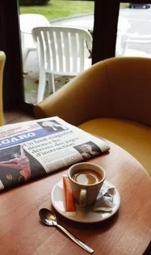 Seating area in Logis Hôtel Novalis Quimperlé