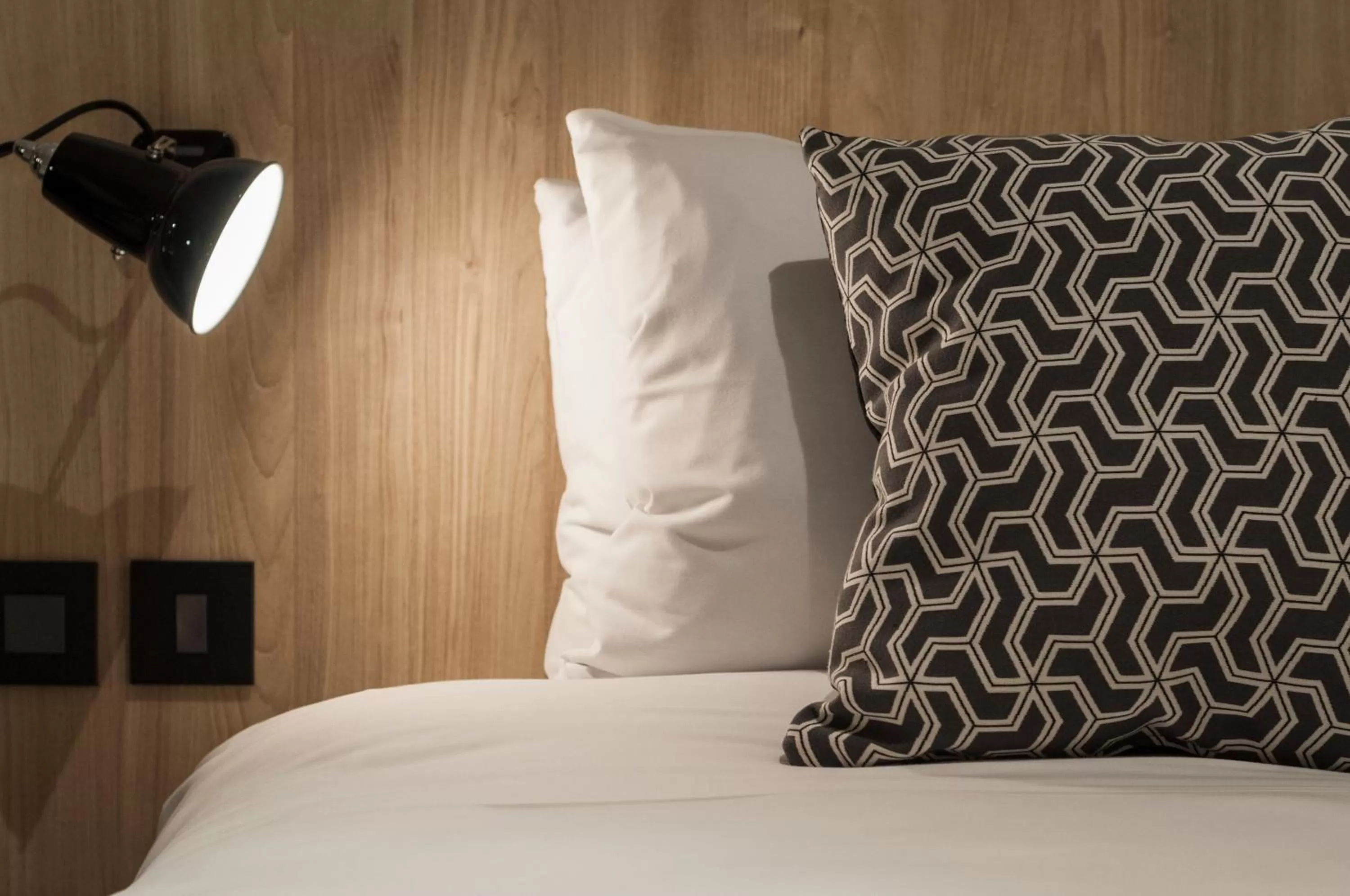 Bed in La Falconeria Hotel