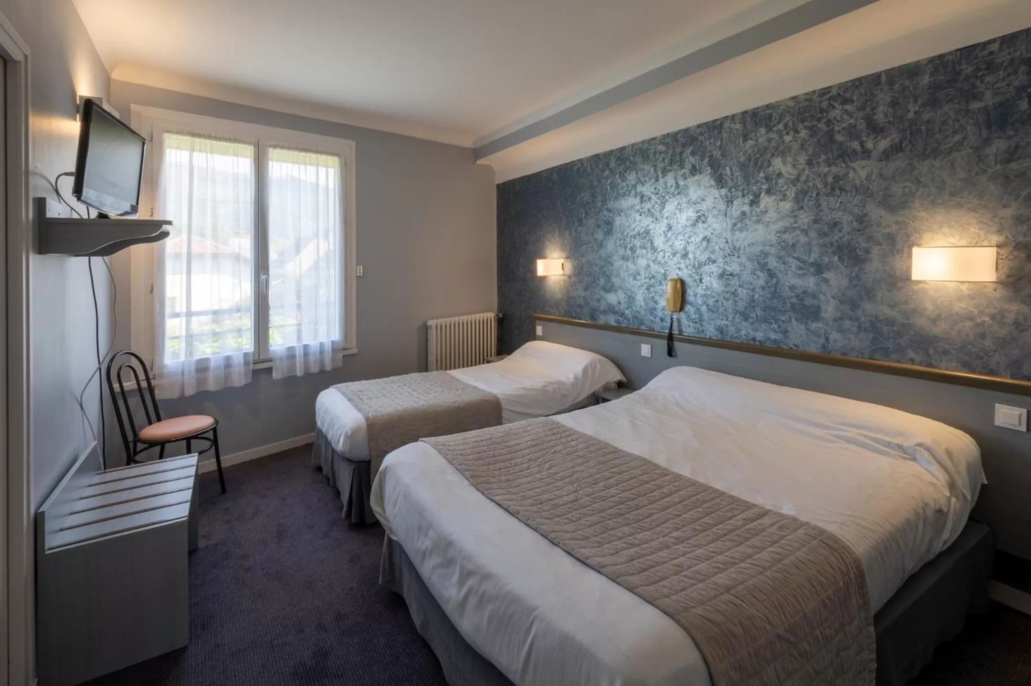 Bed in Hôtel du Soleil Levant