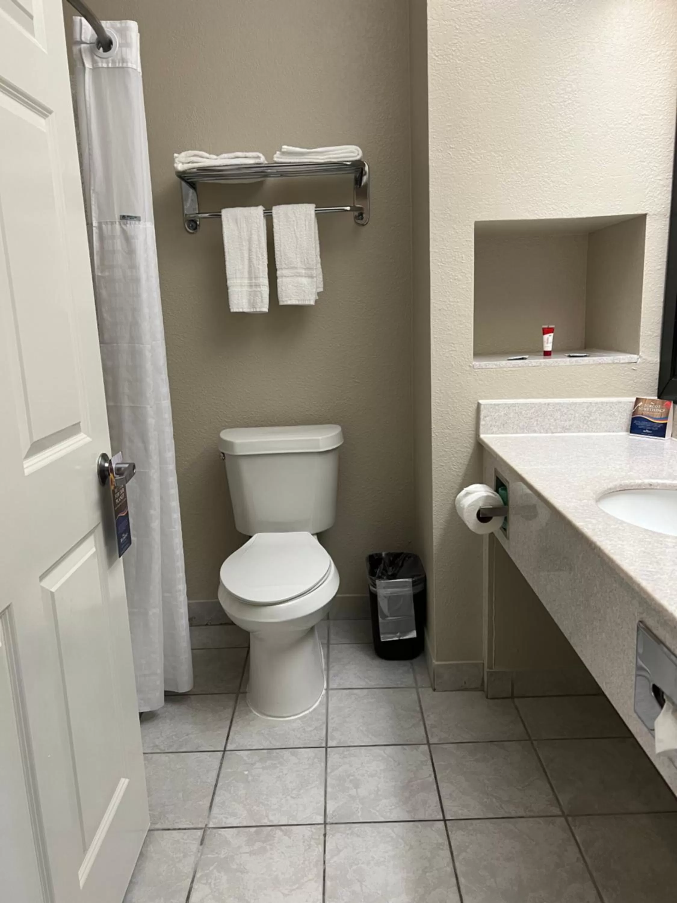 Bathroom in Baymont by Wyndham Houston Brookhollow