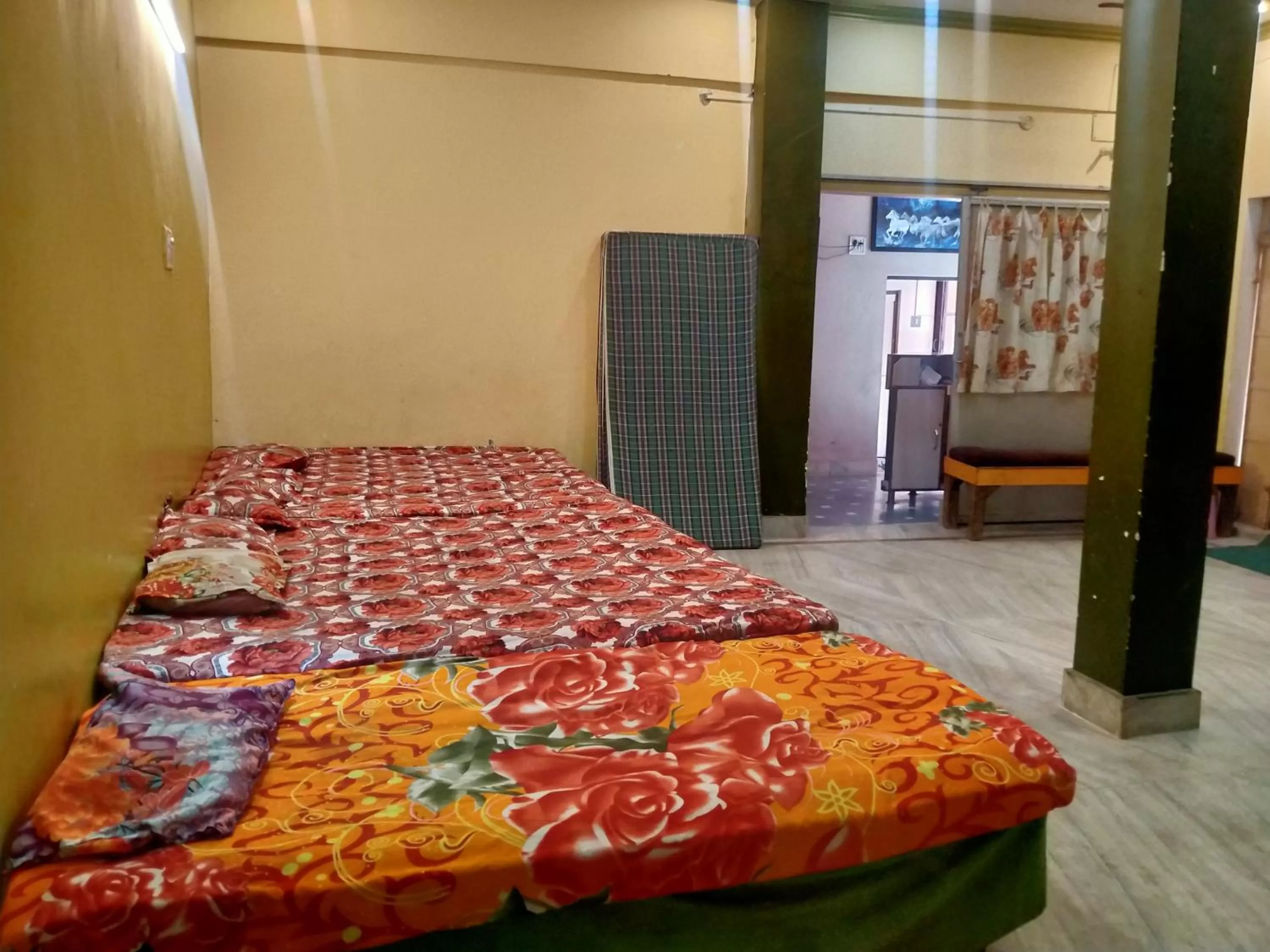 Photo of the whole room, Bed in Hotel Aakash Ganga