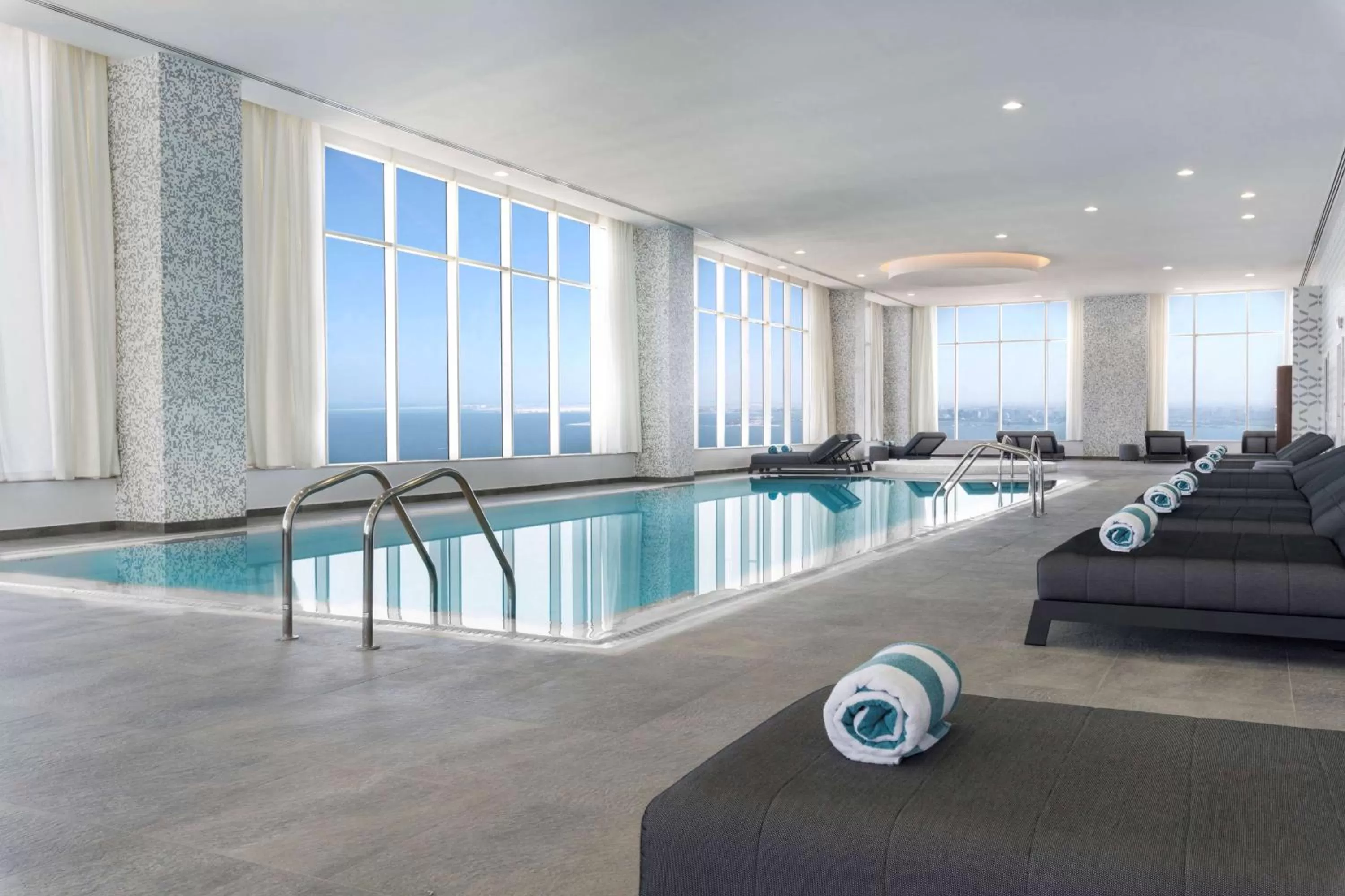 Pool view in Aleph Doha Residences, Curio Collection By Hilton