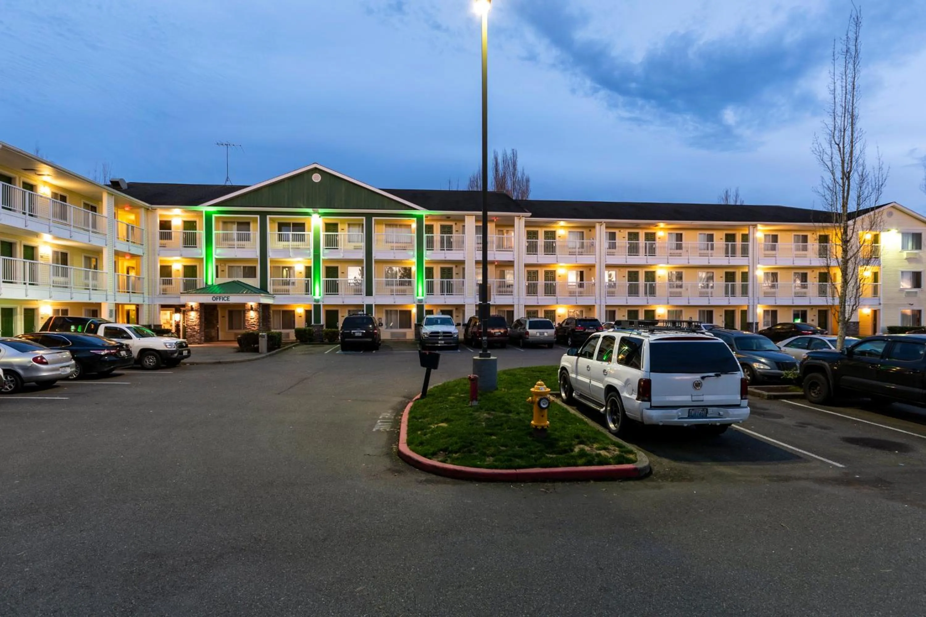 Property building in HomeTowne Studios by Red Roof Seattle - Kent/Des Moines