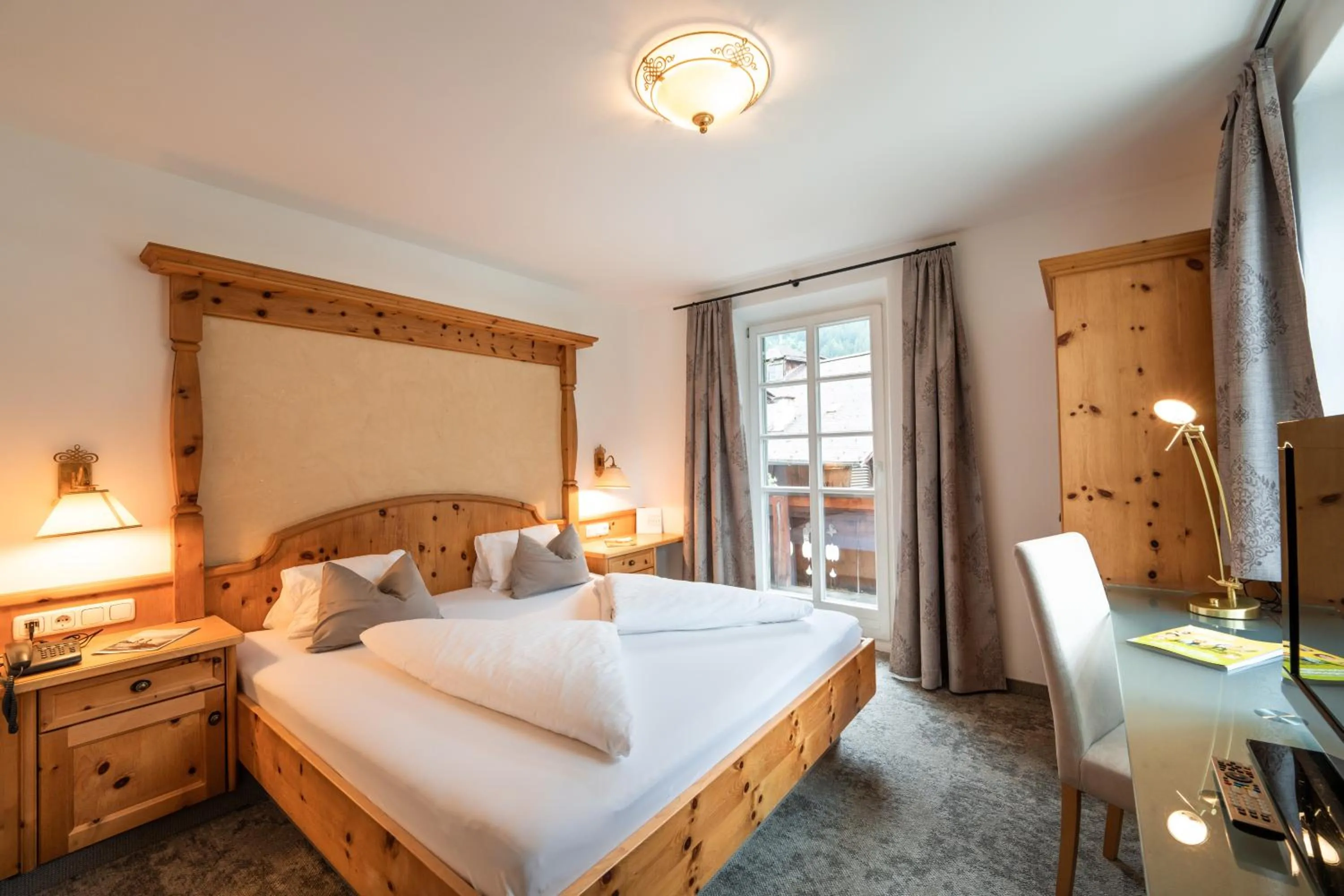 Bed in Alpenhotel Kramerwirt