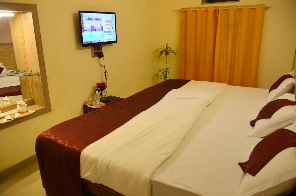 Bed in Hotel Kaveri