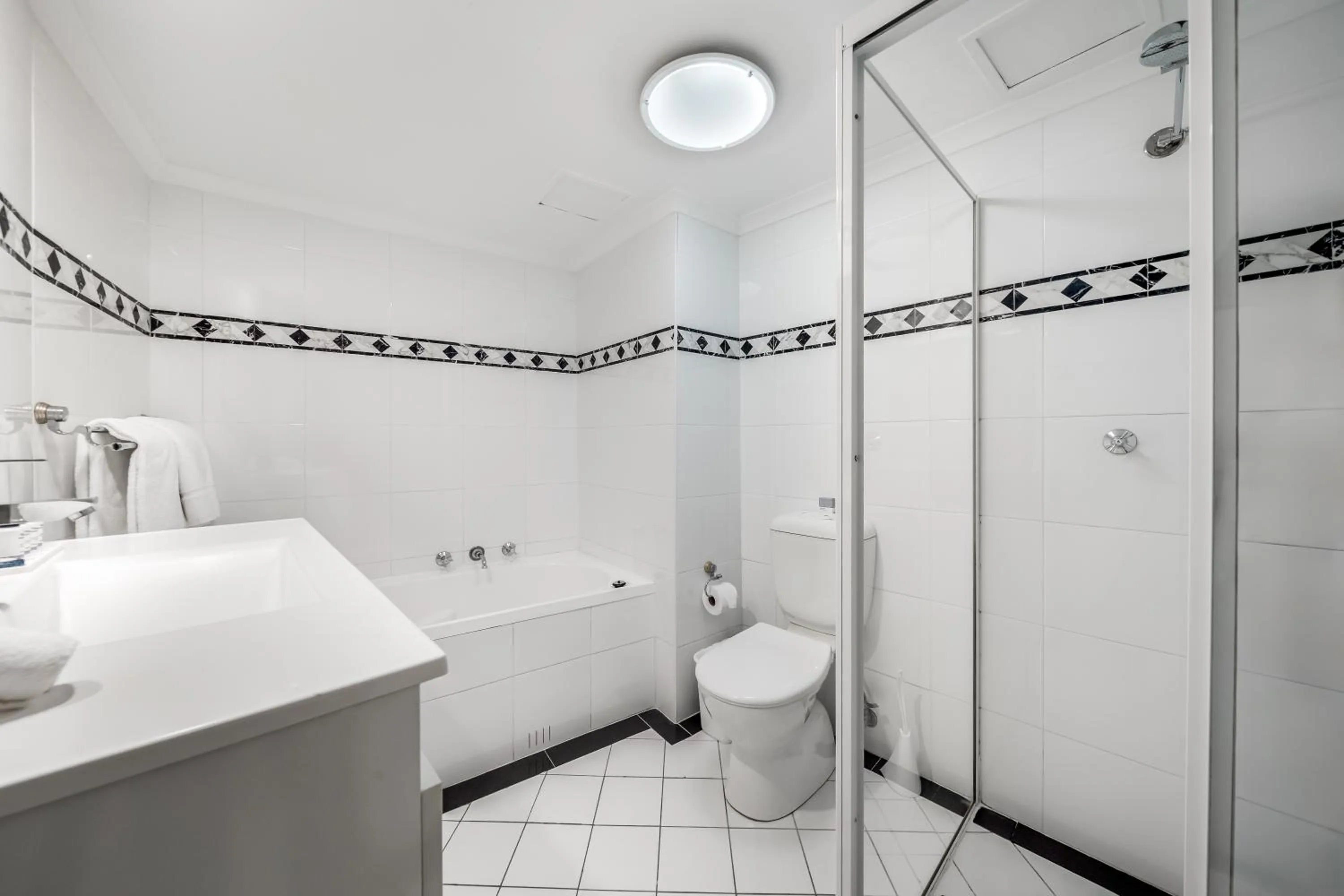 Toilet in Oaks Sydney Castlereagh Suites