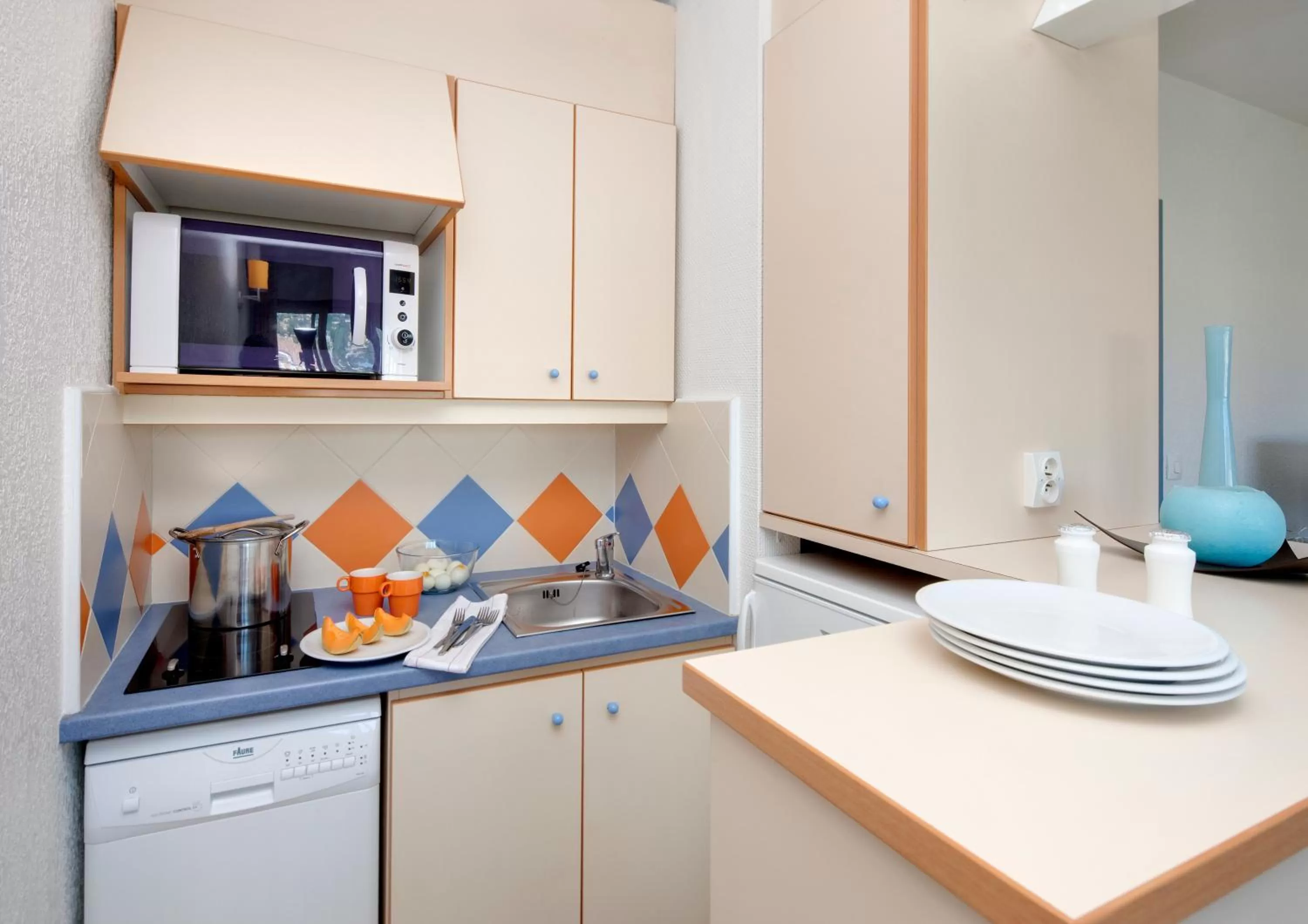 Kitchen or kitchenette in Résidence Pierre & Vacances Les Platanes