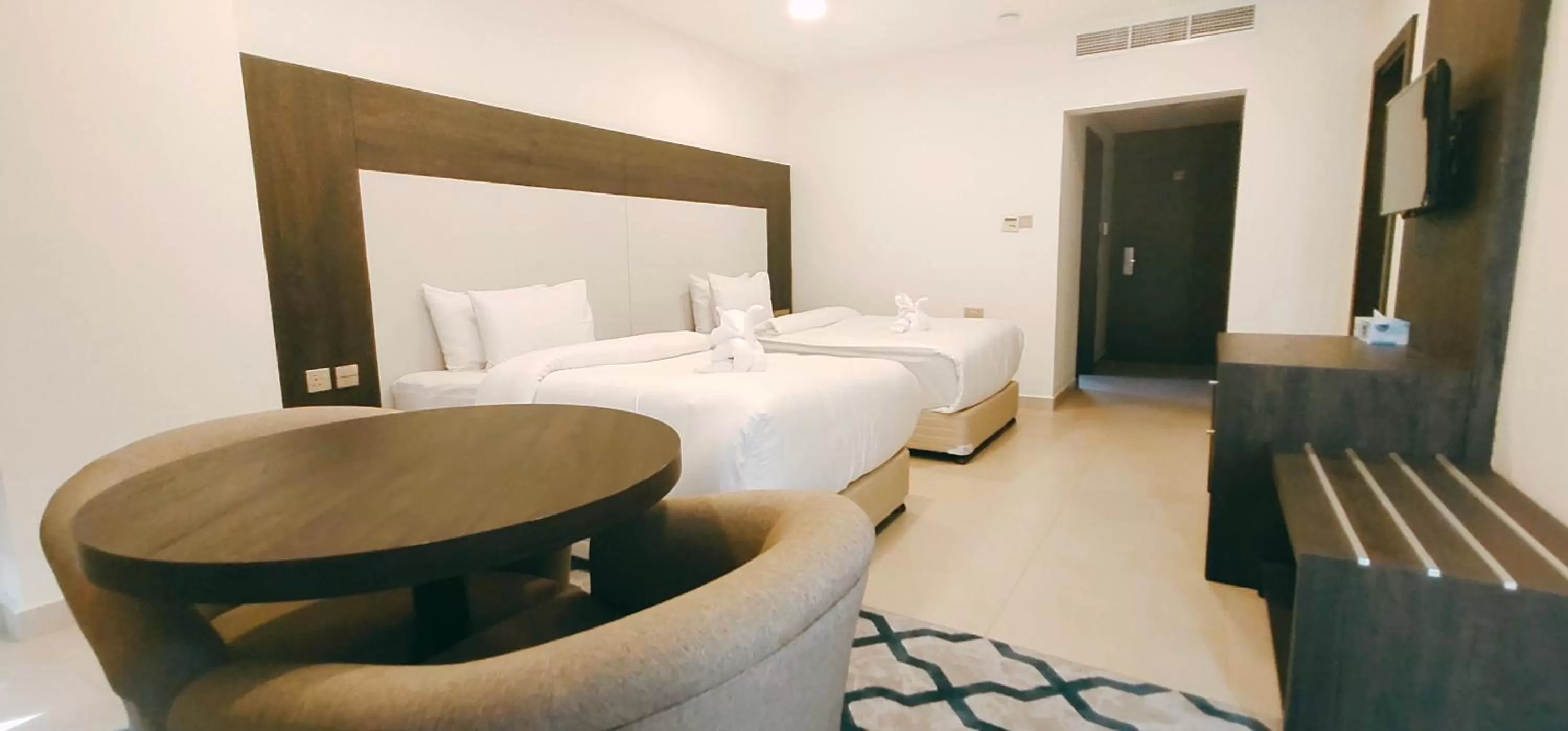 Bed in Manazil Aldar Hotel