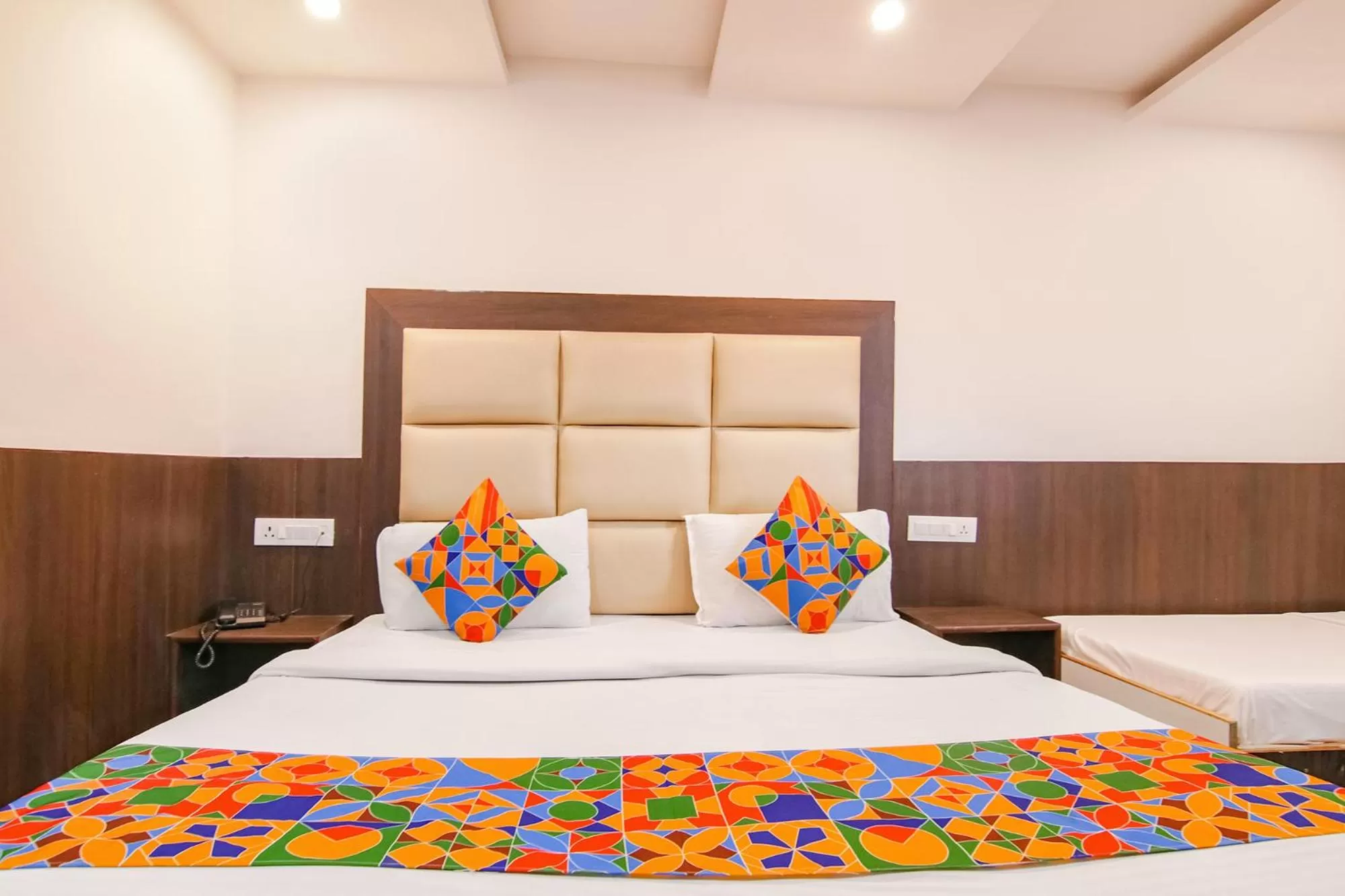 Bed in FabHotel Rosewood Inn I