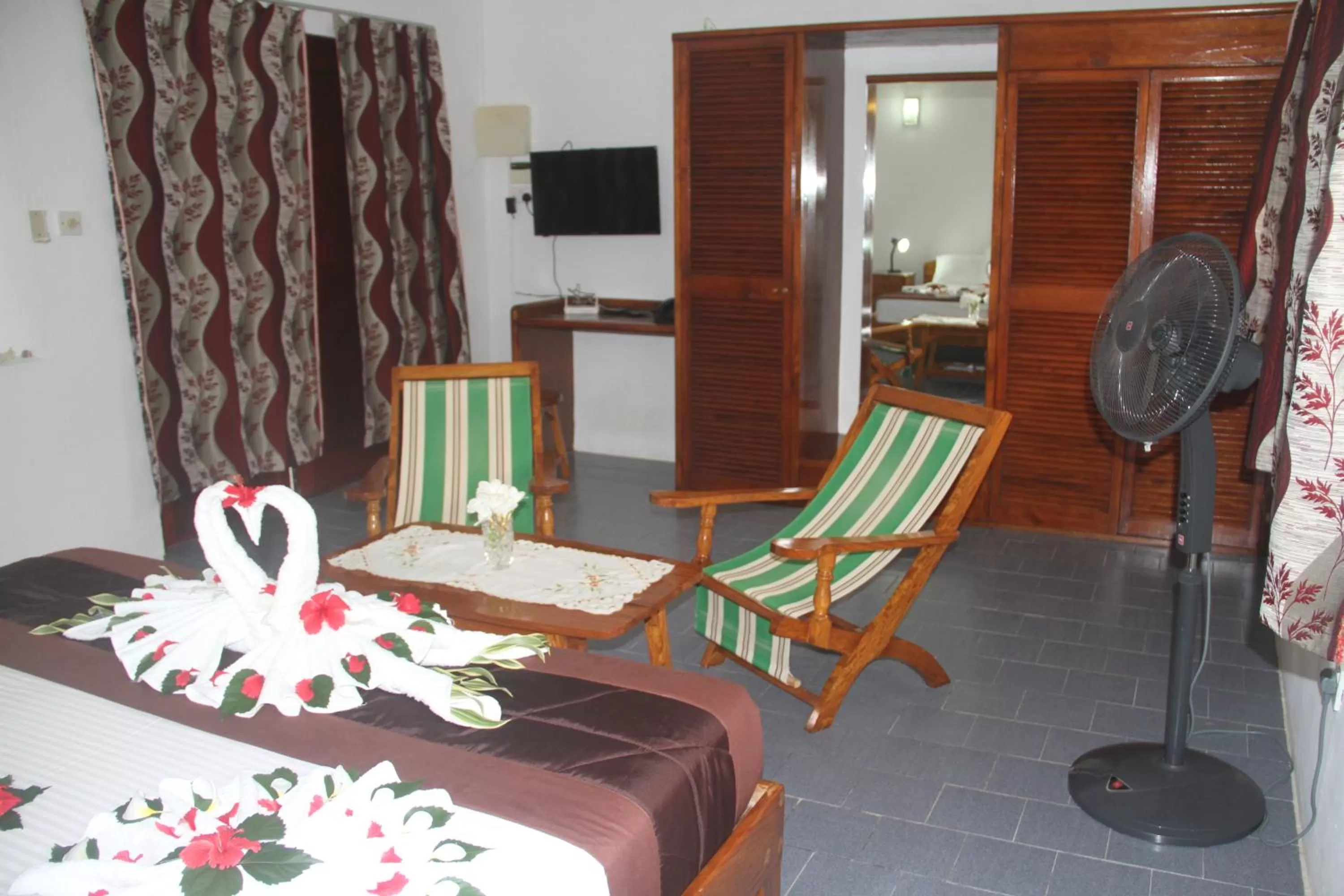Bedroom, Seating Area in Daniella's Bungalows