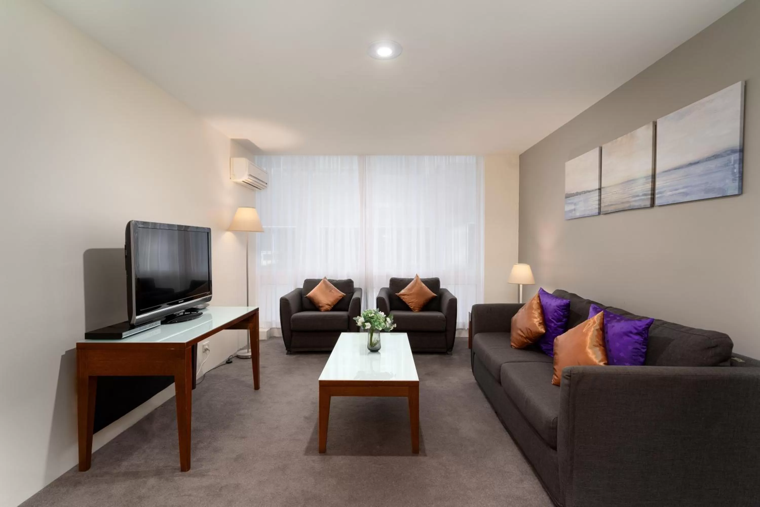 Living room in Park Regis Griffin Suites