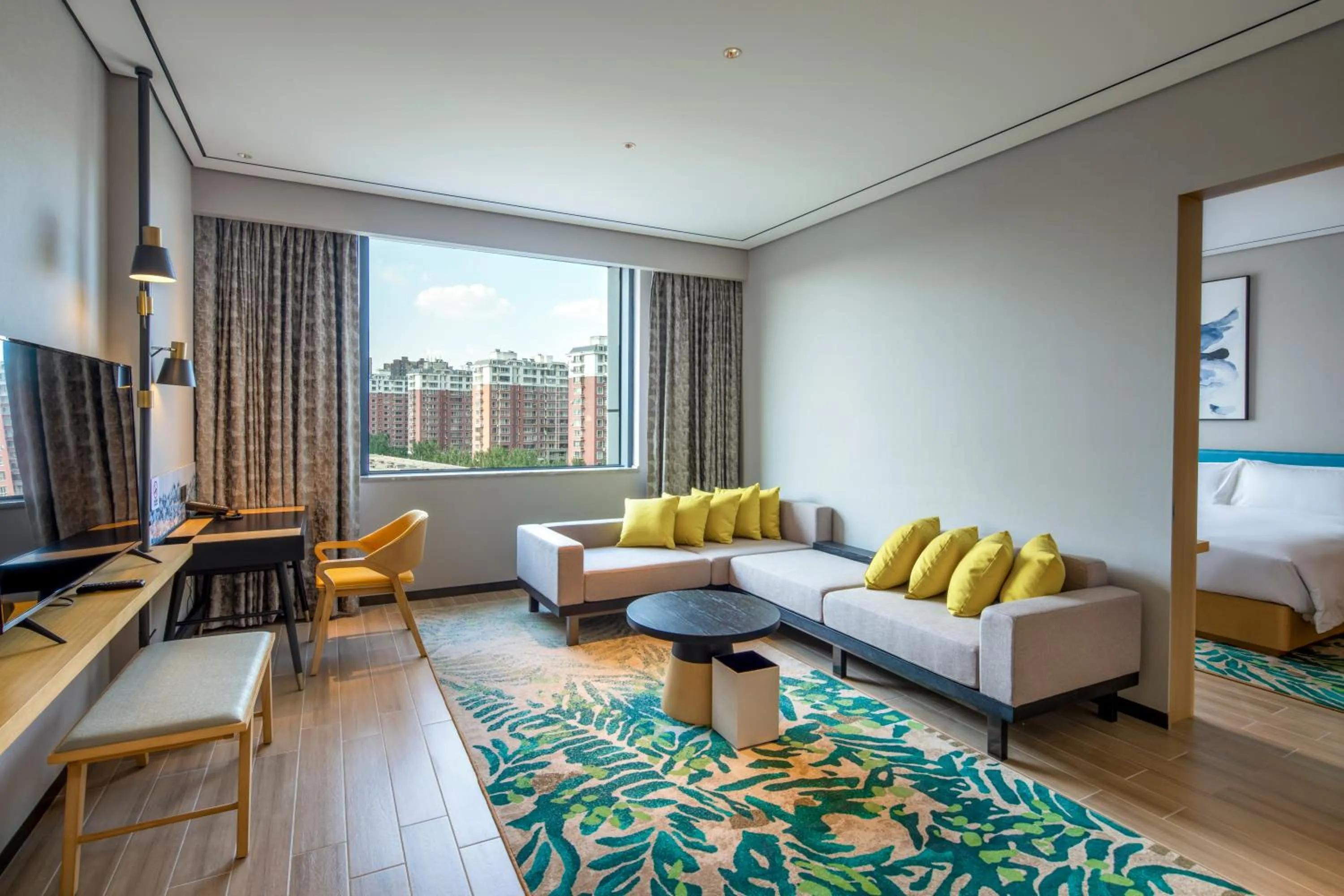 Seating area, Bed in Hilton Garden Inn Changchun Economic Development Zone