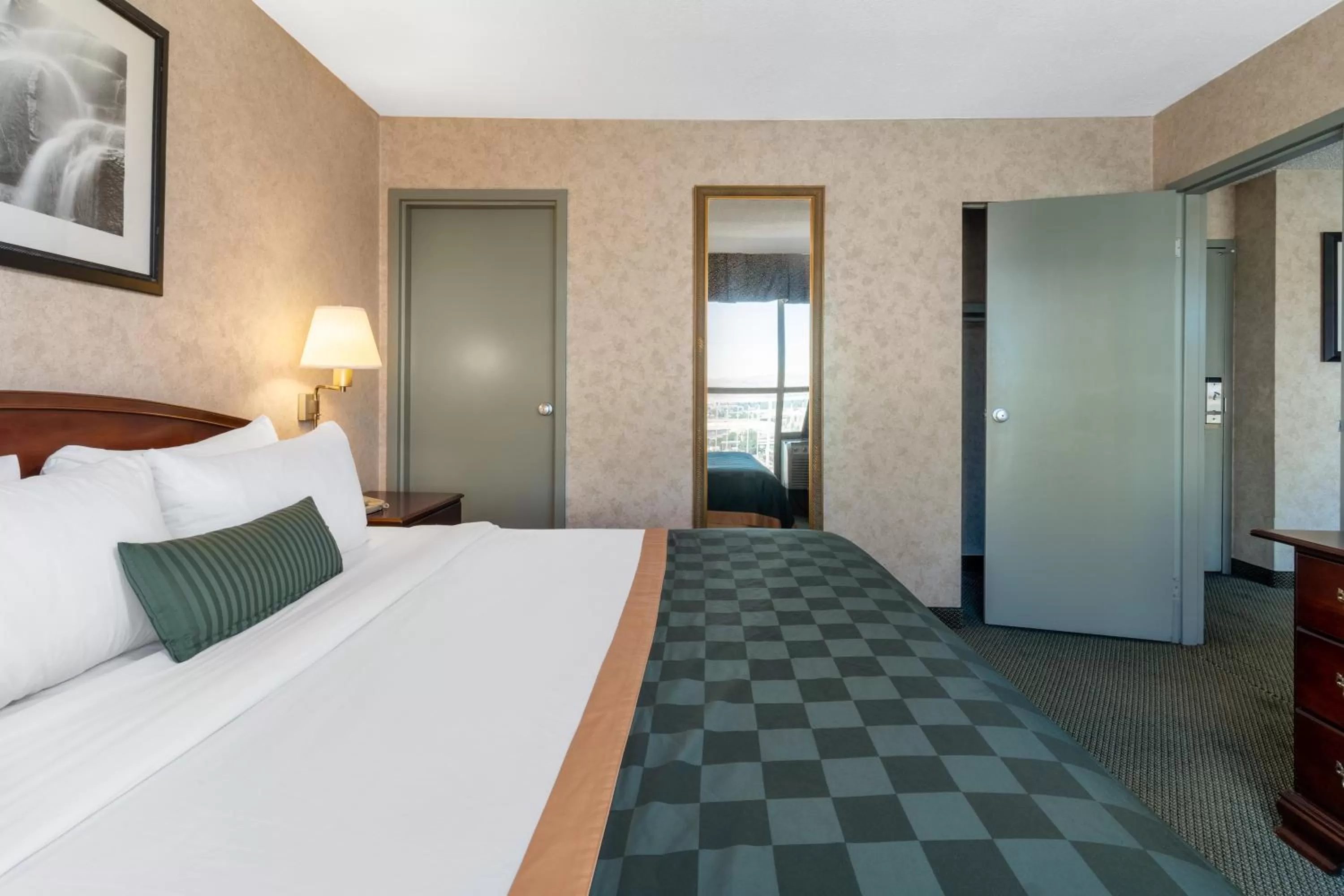 Bed in Ramada by Wyndham Reno Hotel & Casino