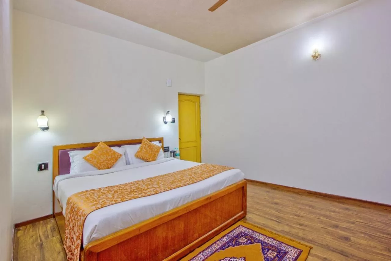 Bed in Ayushman Hotels