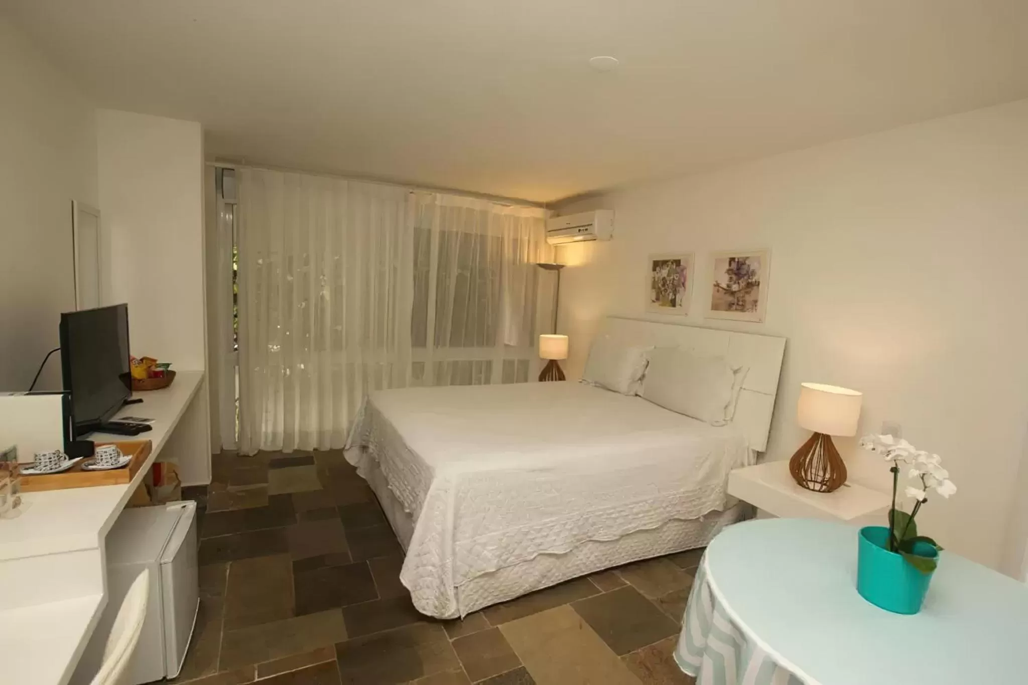 Bed in Guest House Guarujá