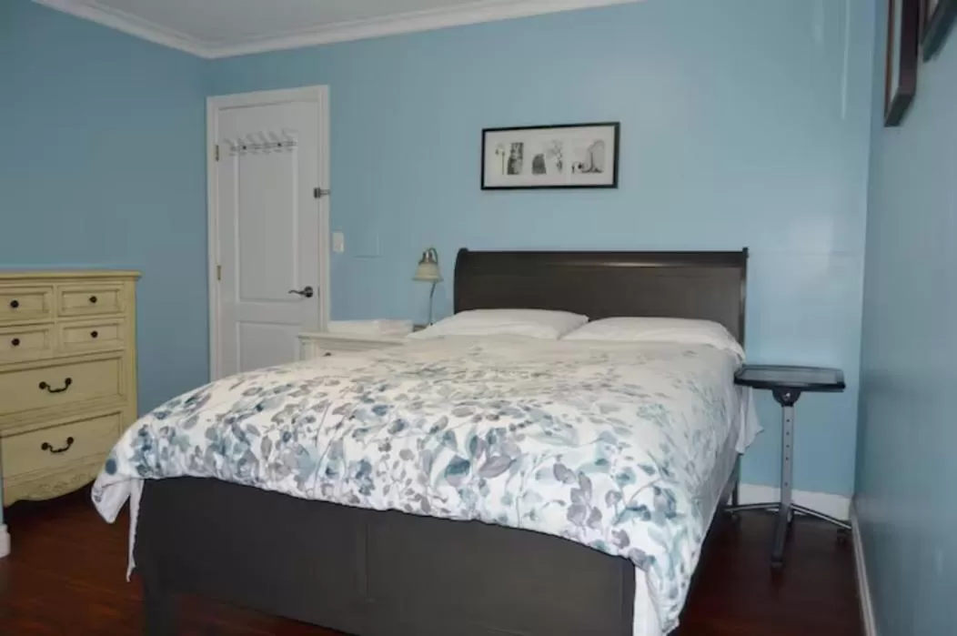 Bed in Jane's private rooms with shared washroom