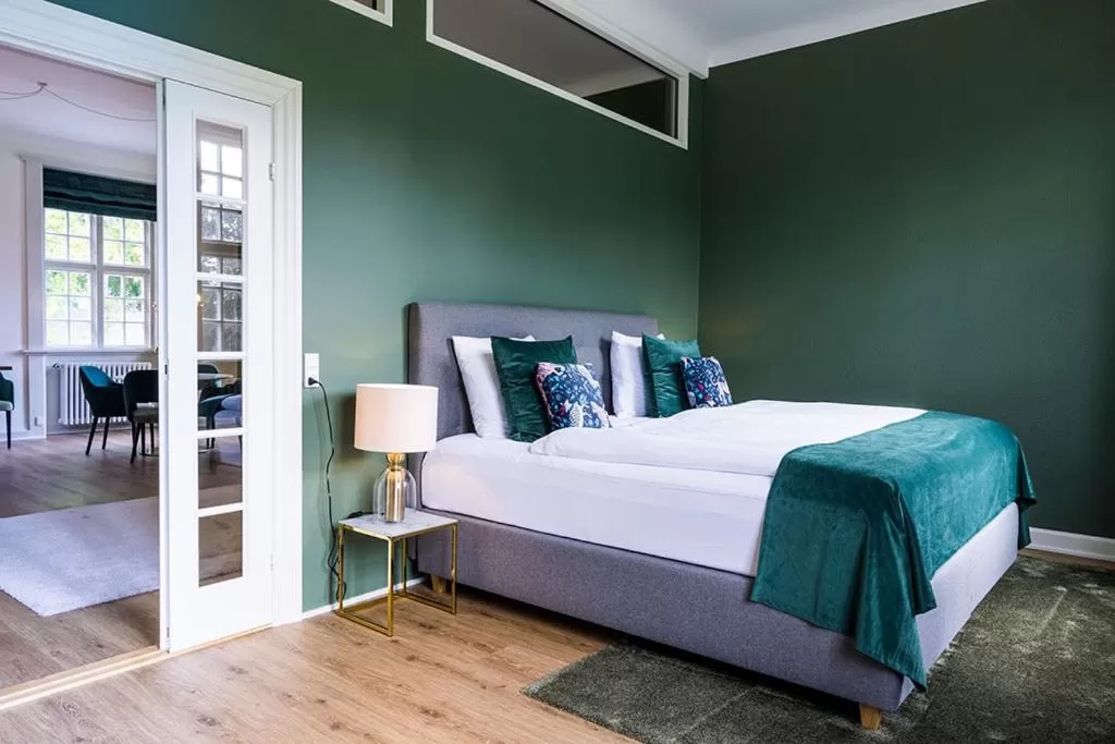 Bed in Gem Suites Holiday Apartments