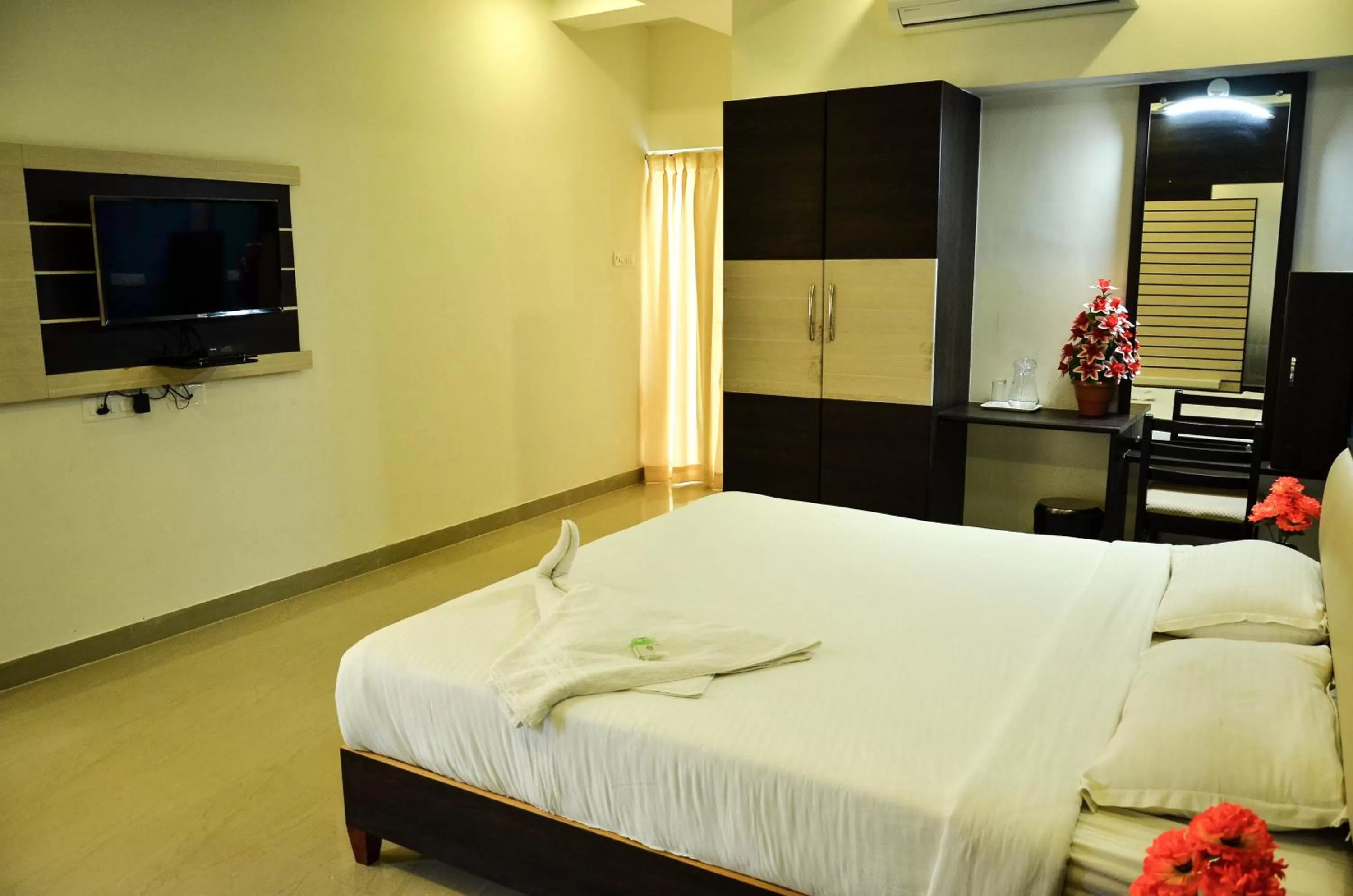 Bed in Hotel Ambai Grand