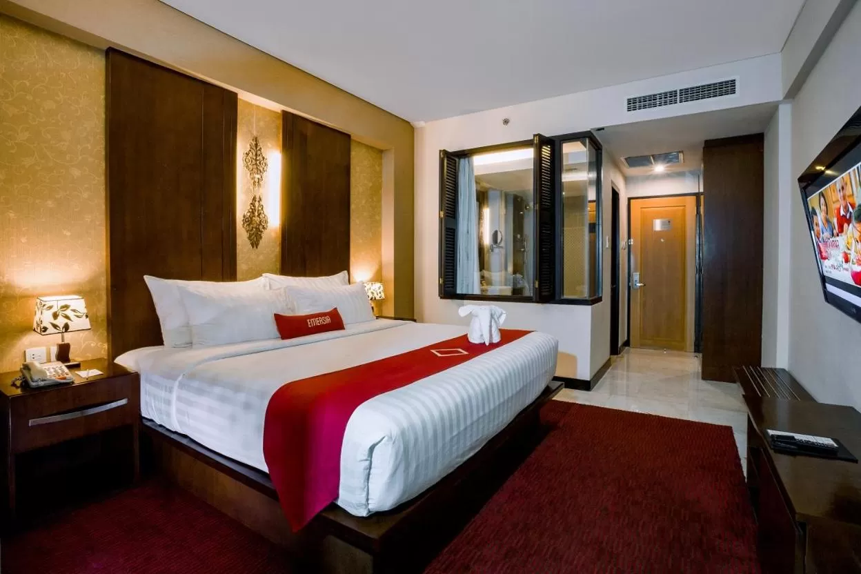 Bed in Emersia Hotel and Resort