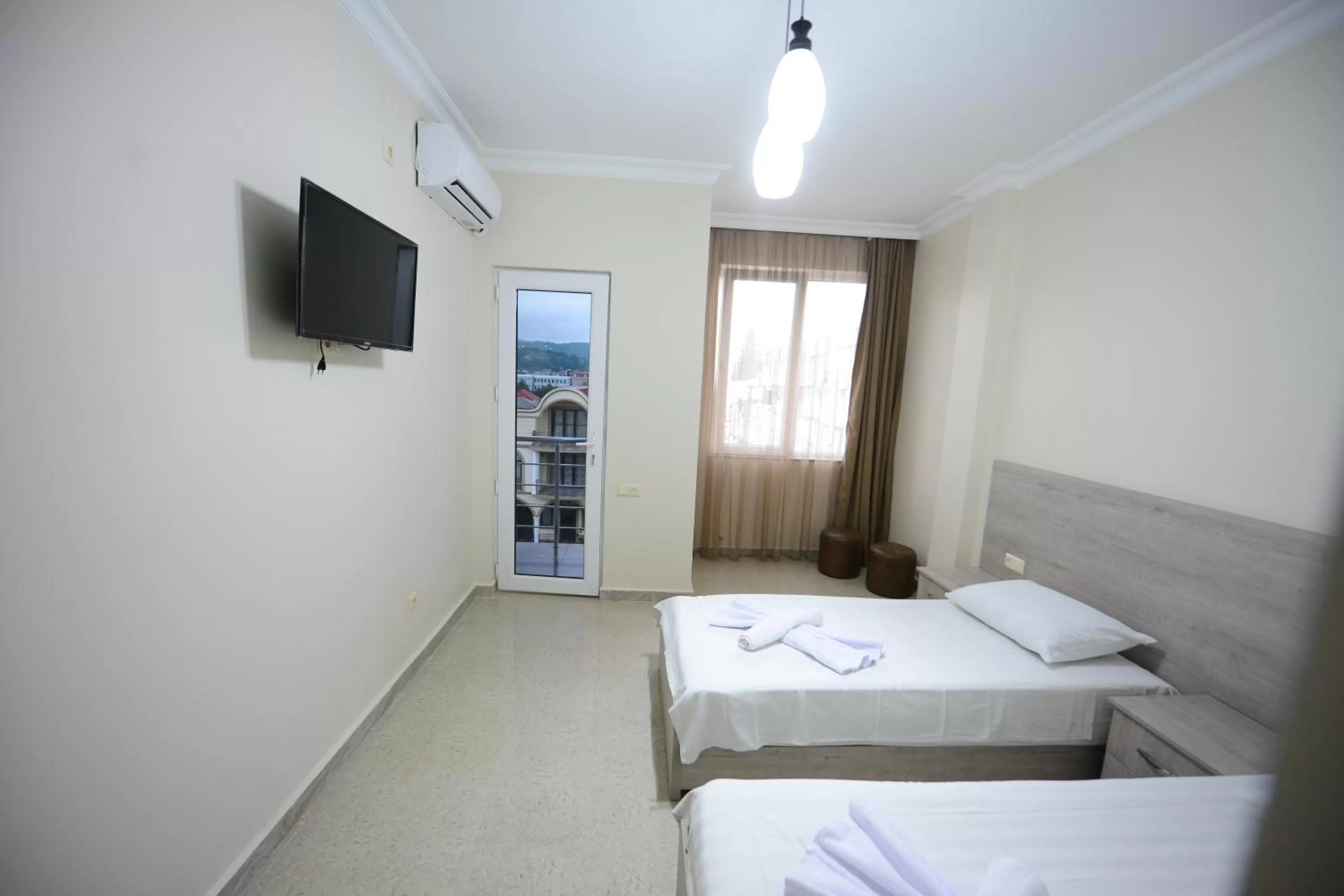 Photo of the whole room, TV/Entertainment Center in Family Hotel