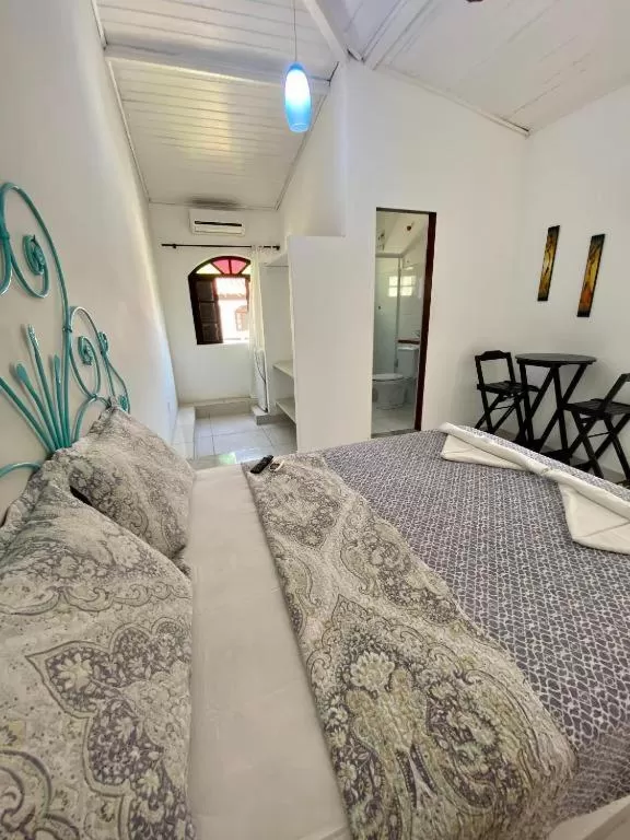 Photo of the whole room, Bed in Pousada Porto Búzios