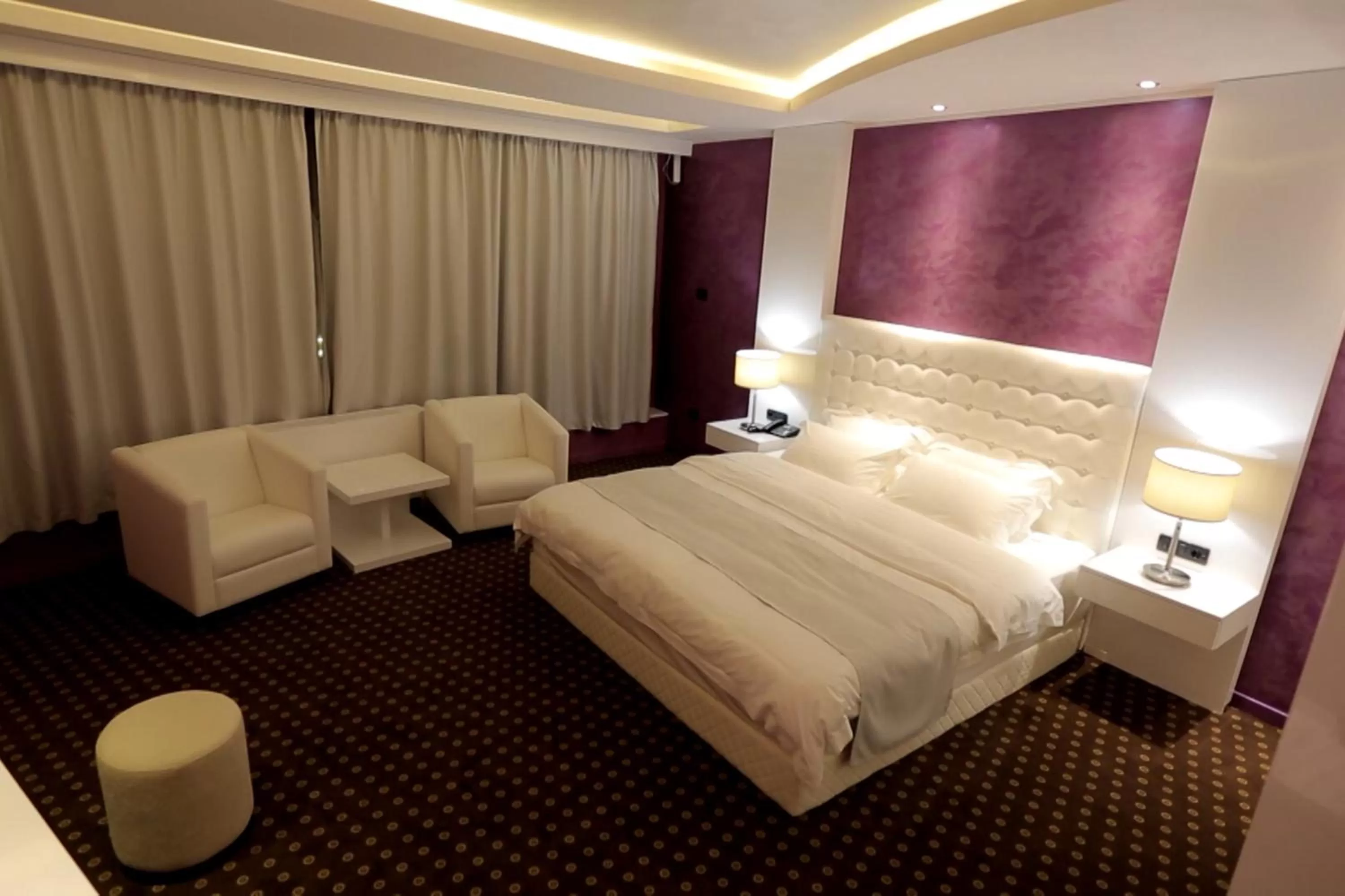 Bed in Orbis Design Hotel & Spa