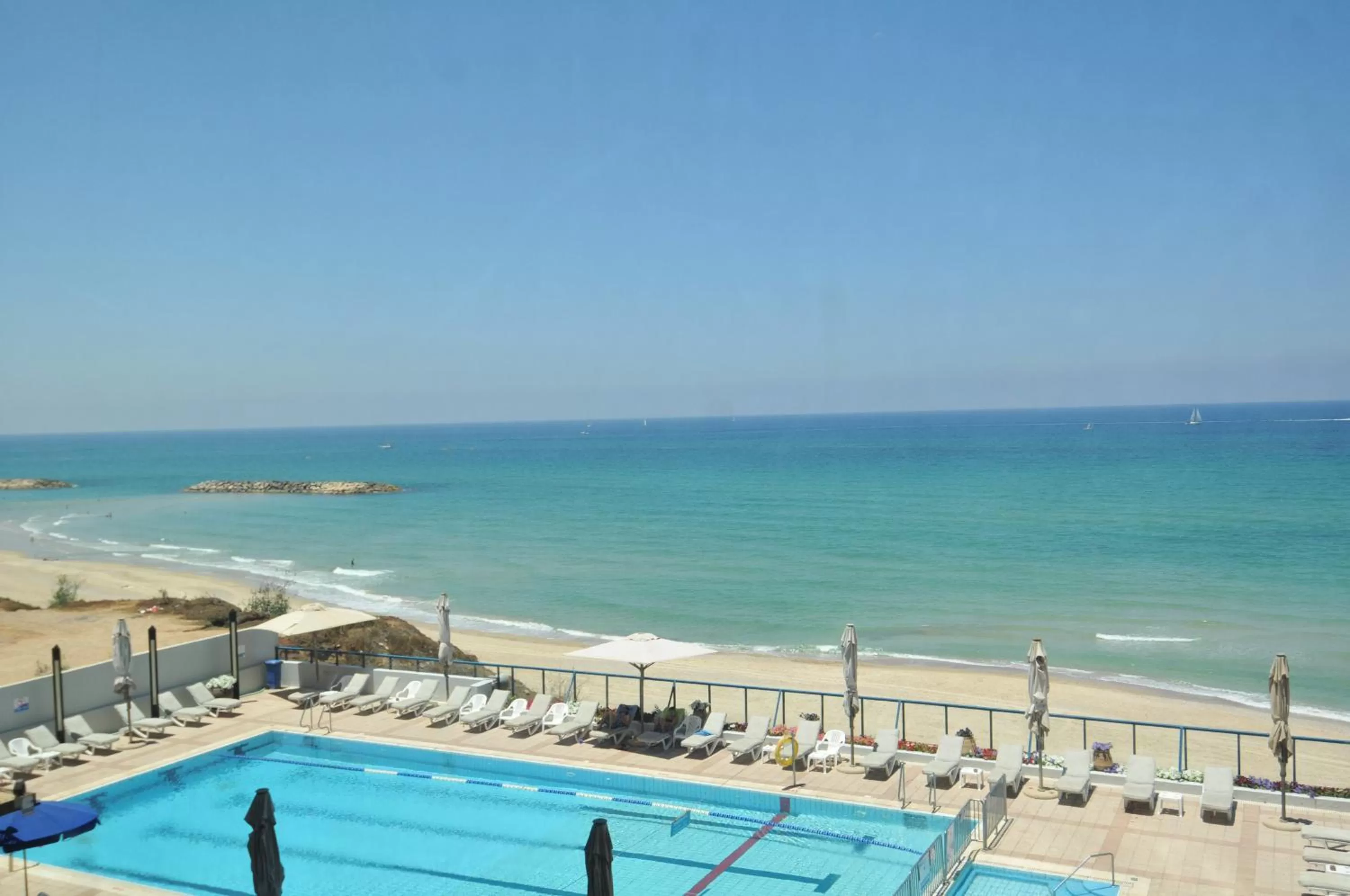 Swimming pool in Herbert Samuel Okeanos Suites Herzilya