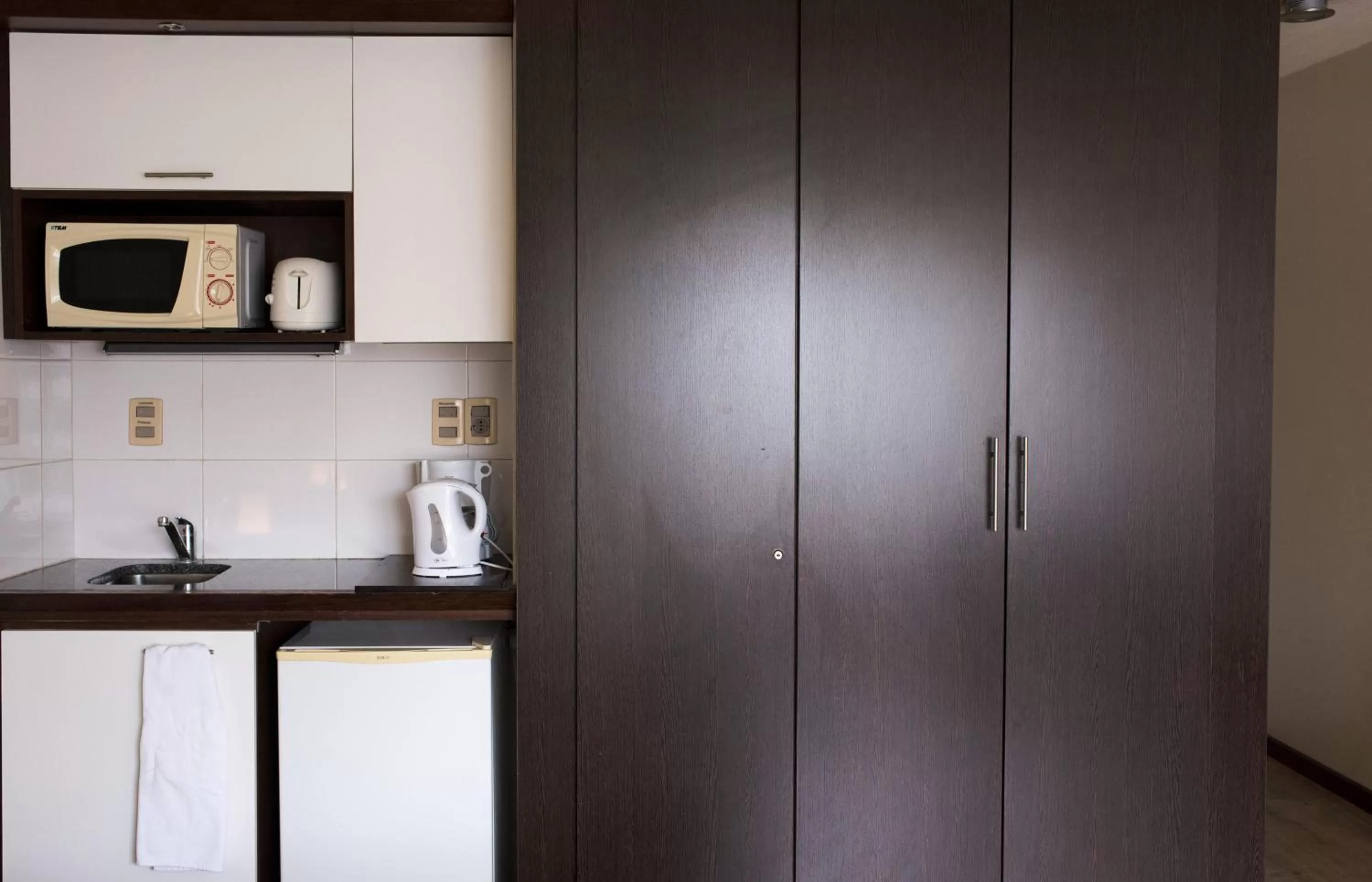 Kitchen or kitchenette in 27 Suites Hotel