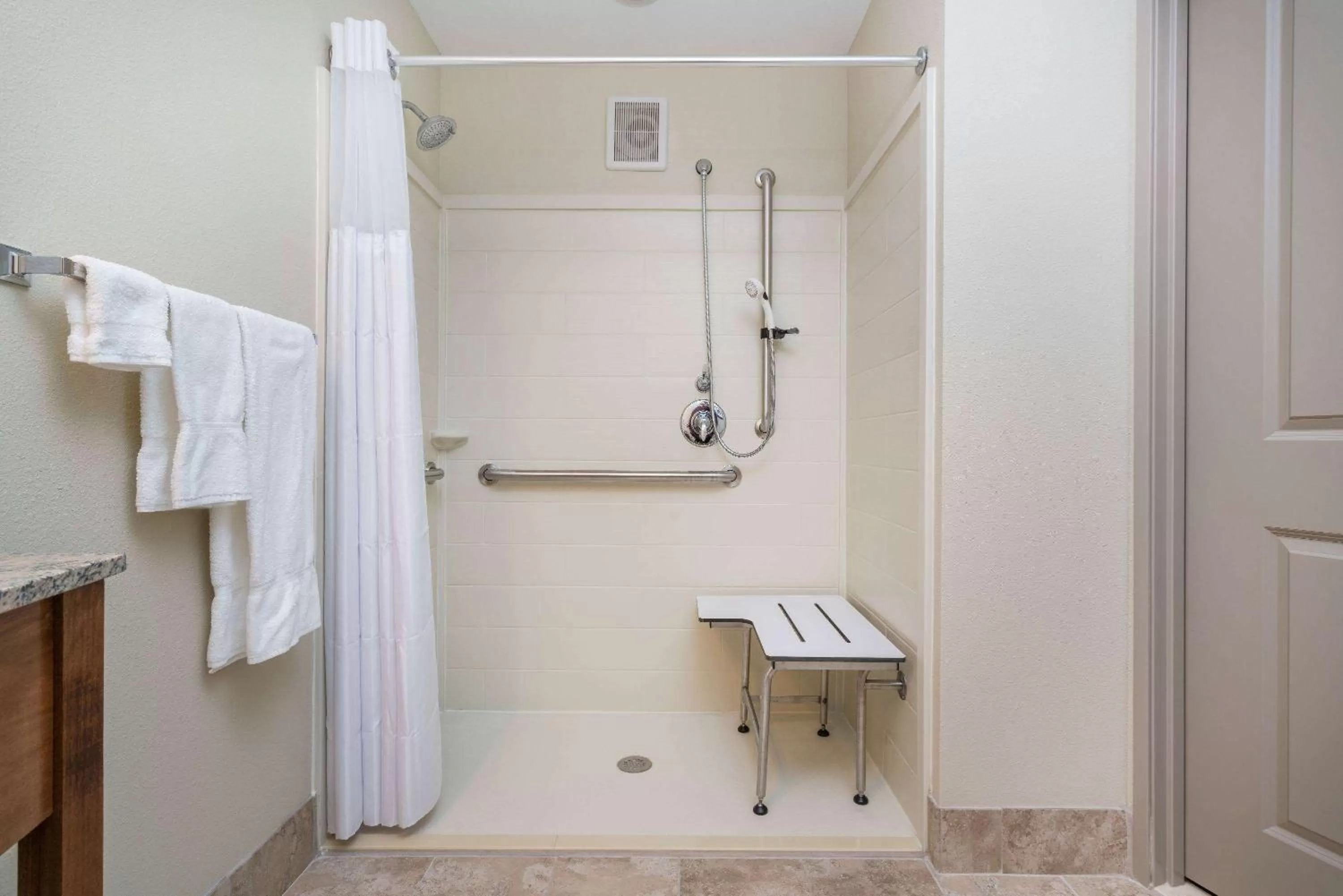 Shower in AmericInn by Wyndham Winona