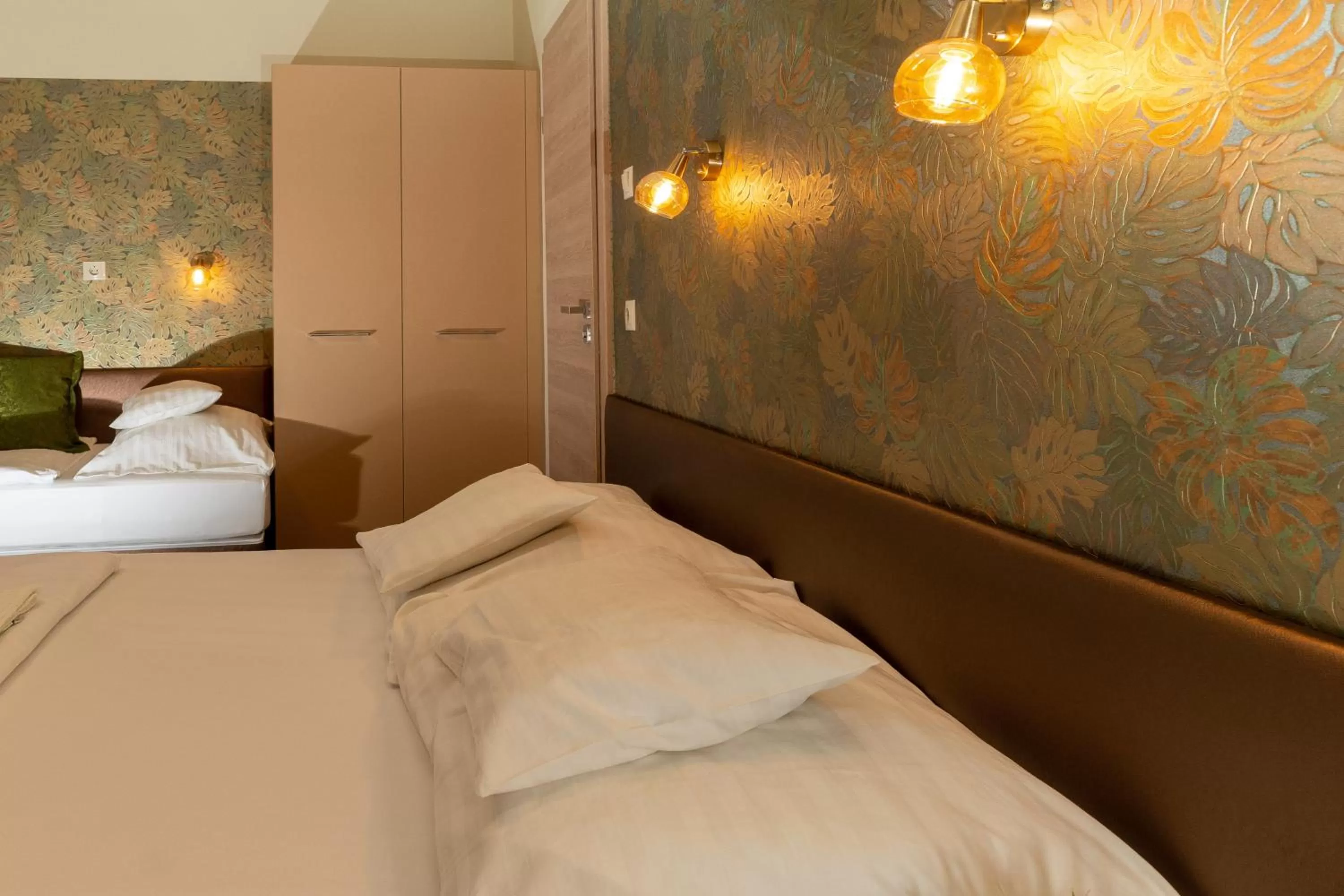 Bed in Teátrum Boutique Hotel