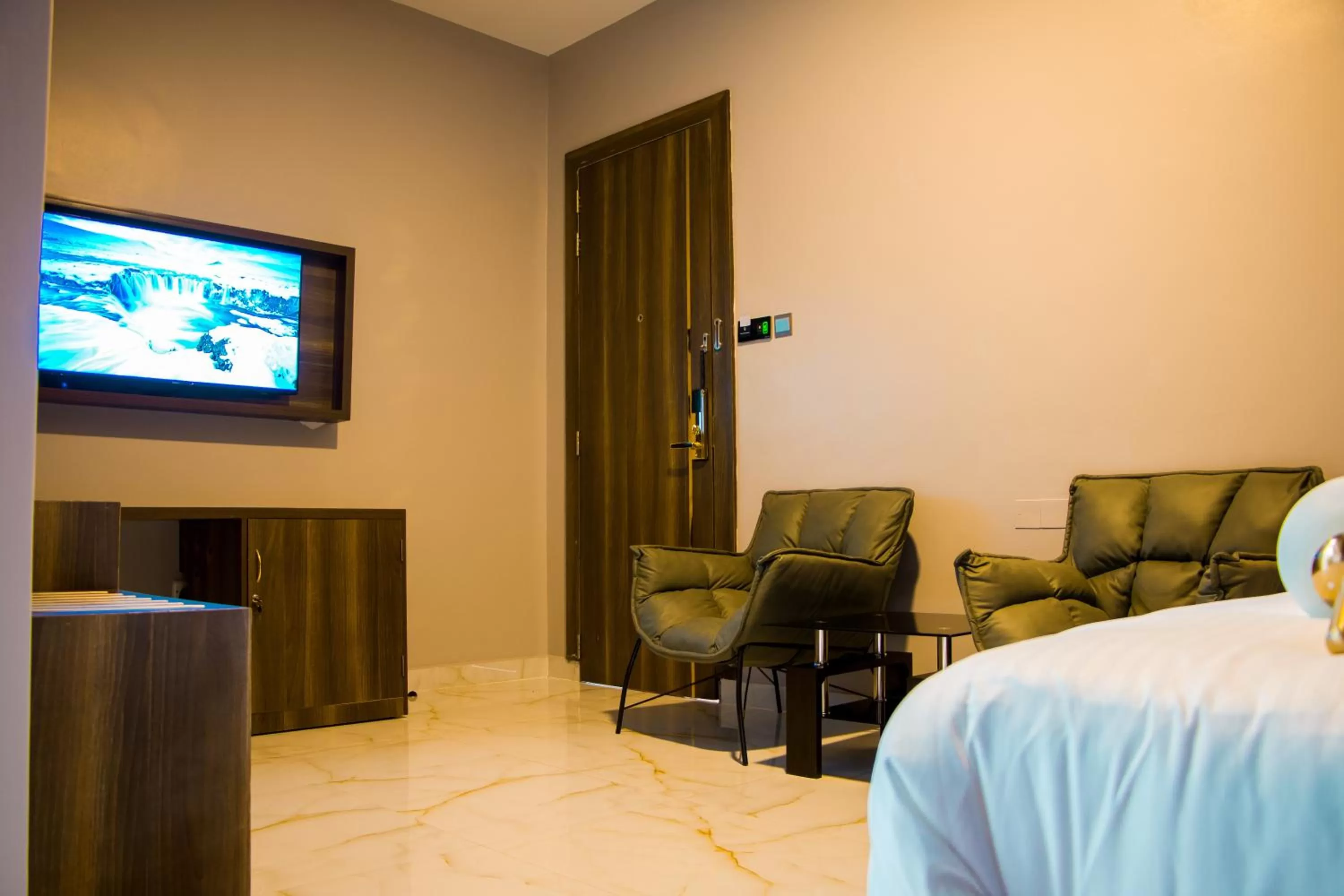 Seating area, Bed in Hotel Horizon Entebbe