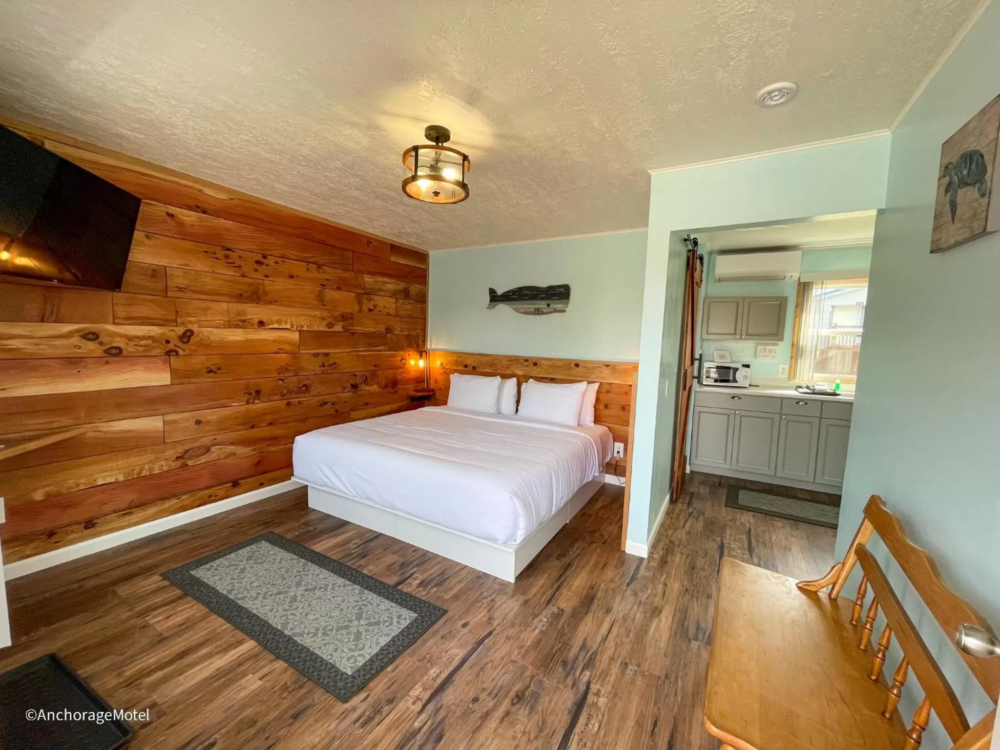 Bed in The Anchorage Motel