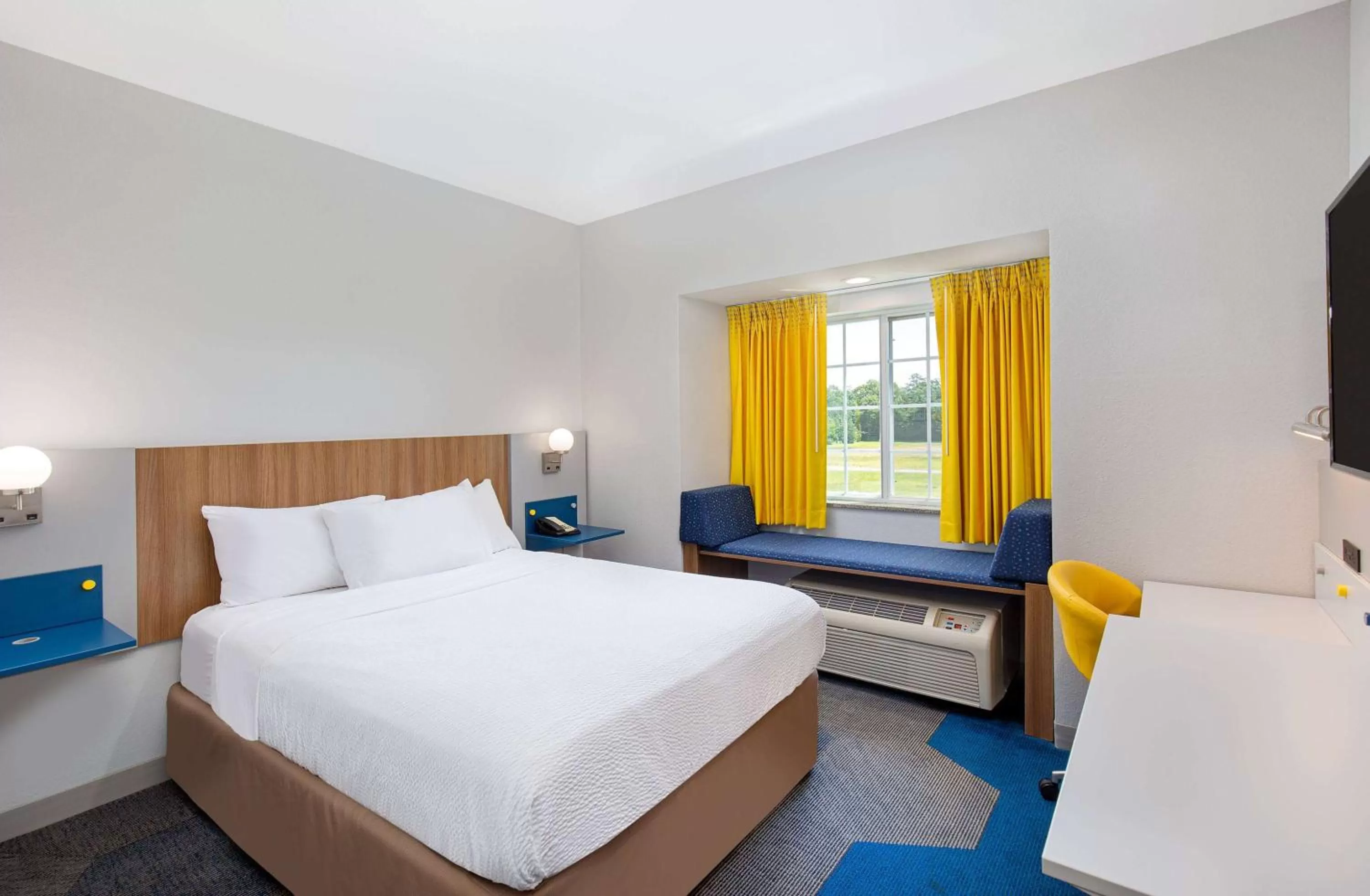 Bed in Microtel Inn and Suites by Wyndham