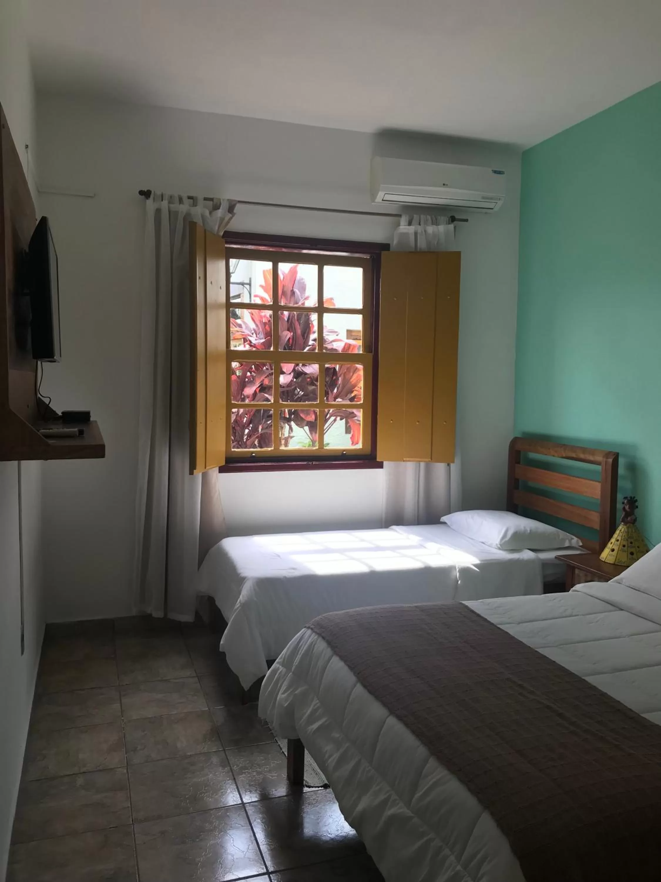 Bed in Pousada Neuza Barbosa