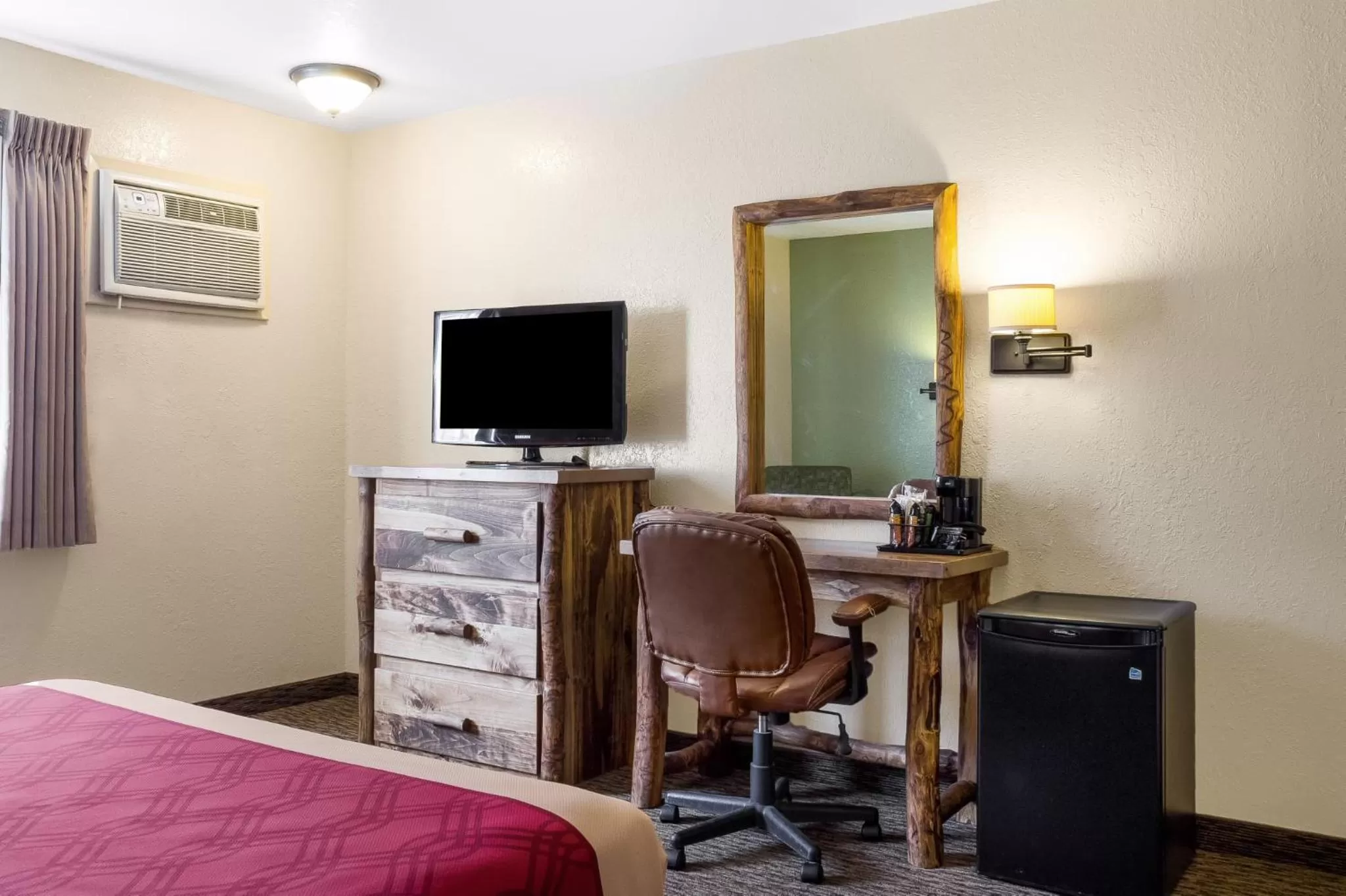 Decorative detail, Bed in Econo Lodge, Downtown Custer Near Custer State Park and Mt Rushmore