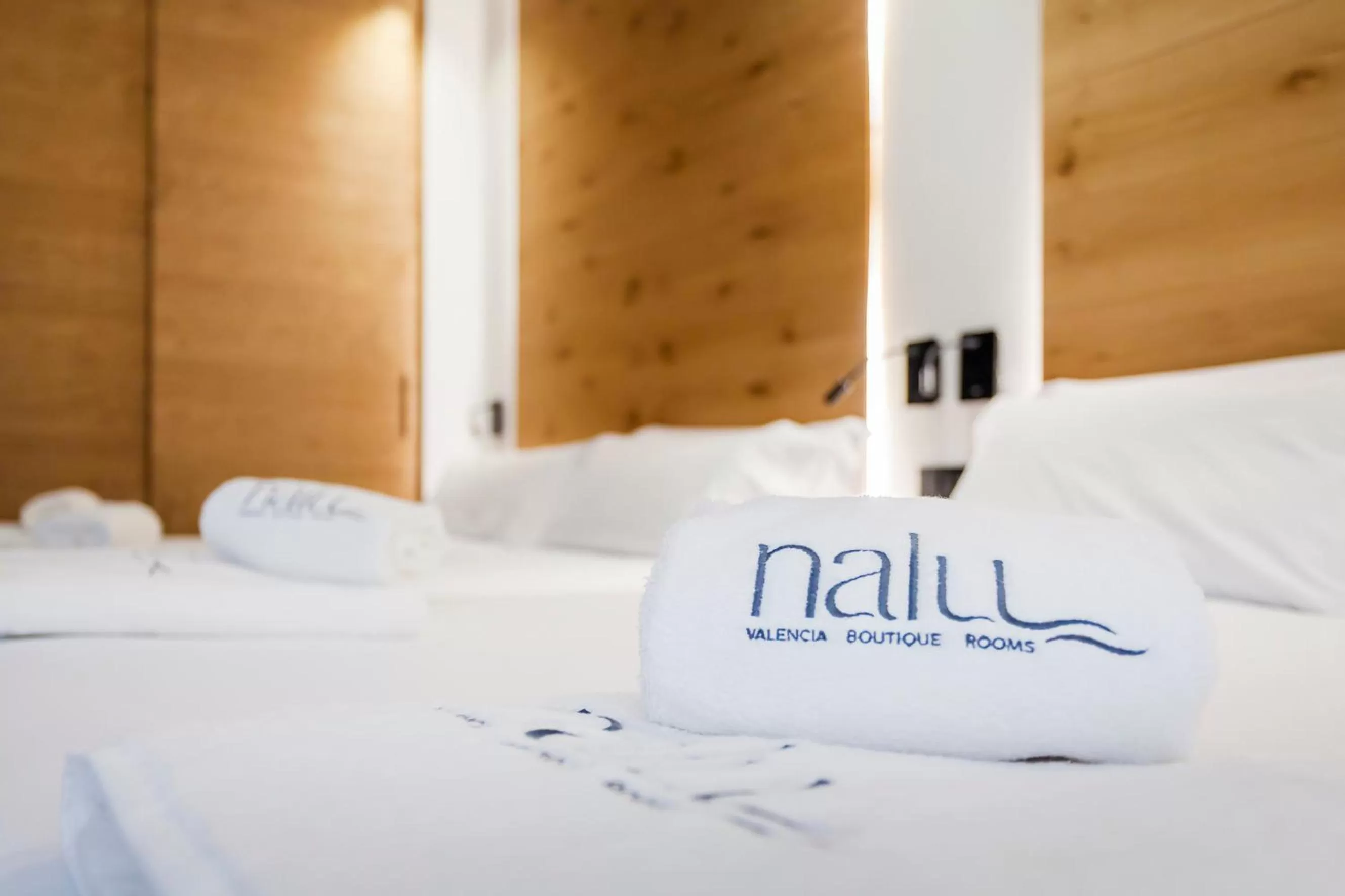 towels, Bed in NALU Valencia Boutique Rooms