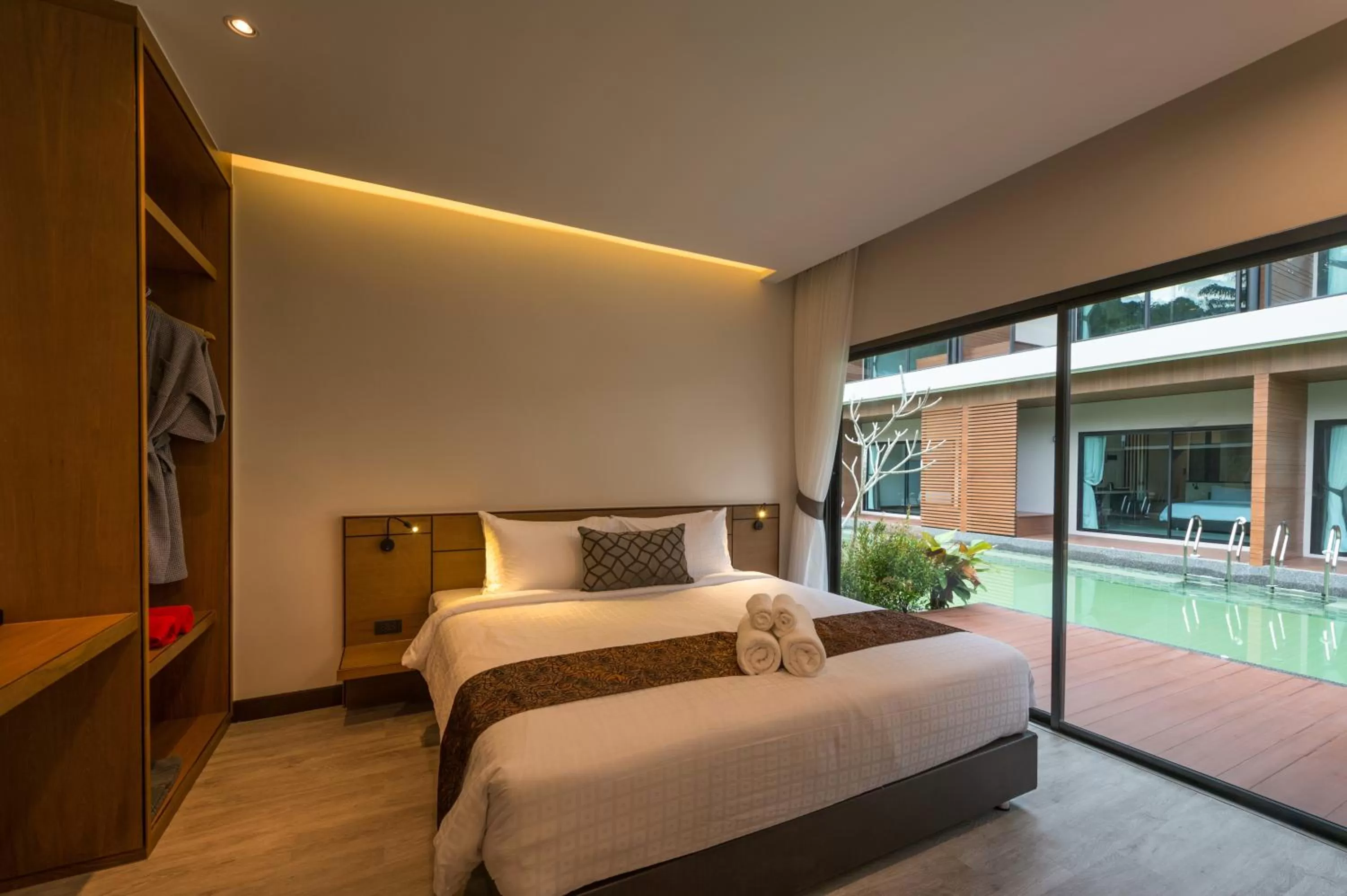 Bed in Cher​mantra​ Aonang​ Resort & Pool​ Suite